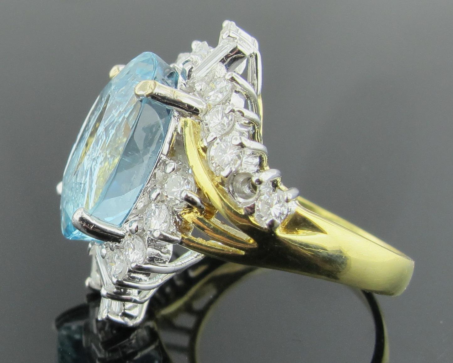 Oval Cut Aquamarine and Diamond Ring set in 18 karat yellow gold