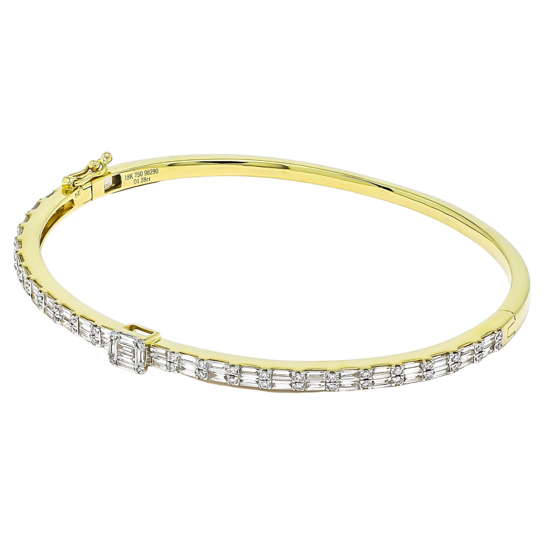 Immerse yourself in the timeless elegance of this 18 Karat gold bangle bracelet, adorned with stunning baguette diamonds arranged in a captivating double-row design totaling 1.28 carats. Each diamond has been meticulously set to create a mesmerizing
