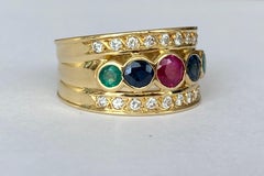 18 Kt. Yellow Gold Band Ring with 0.90 Ct Ruby, Sapphire, Emerald  and Diamonds