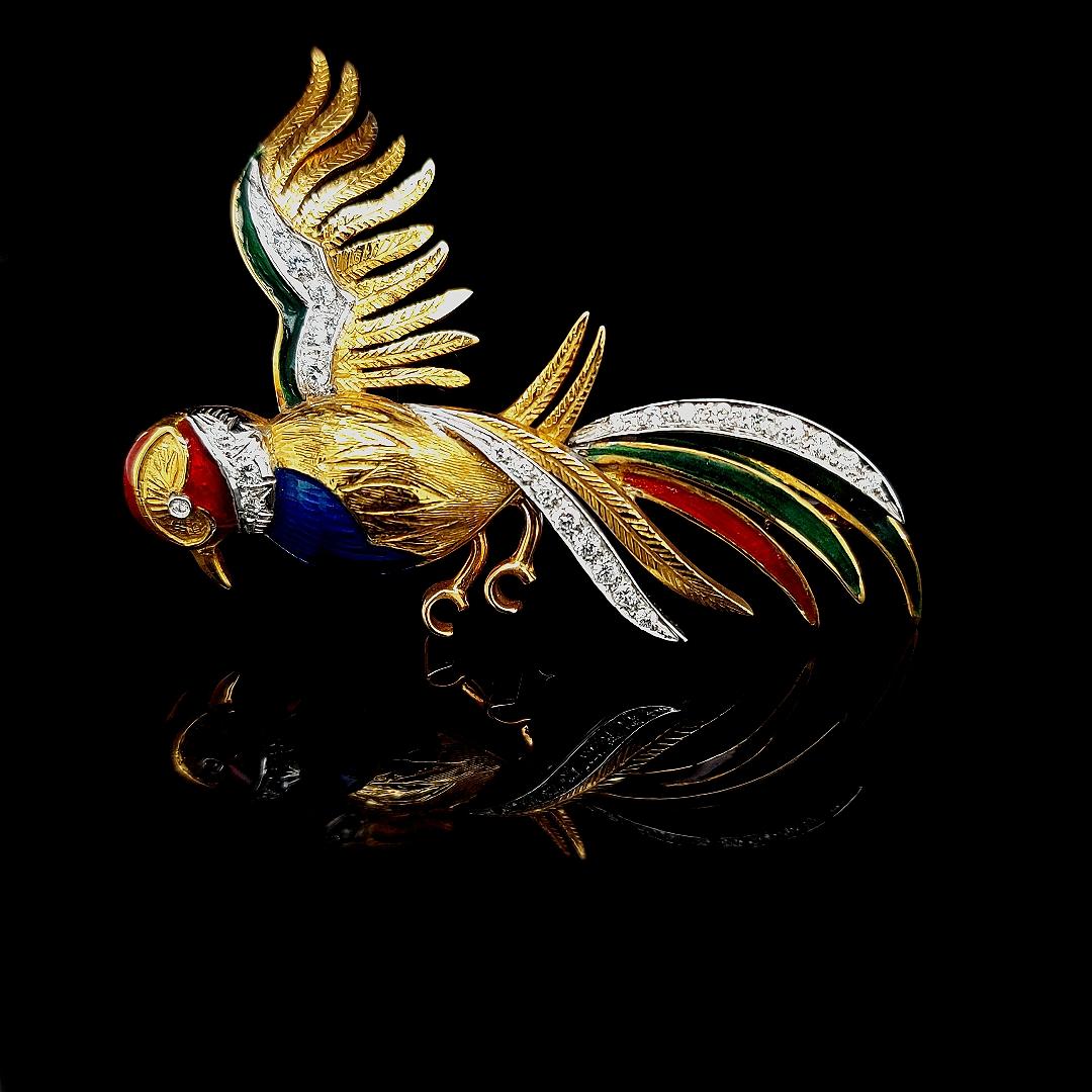 18 kt yellow gold Bird of Paradise brooch with diamonds and enamel, seeing this brooch will brighten up anyone's day.

Diamonds: 26 brilliant cut diamonds : 0,52 ct nice color and clarity

Material: 18 Kt yellow gold

Total weight: 12.7 grams /