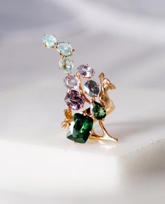 Eighteen Karat Gold Sculptural Brooch with Sapphires and Paraiba Tourmalines
