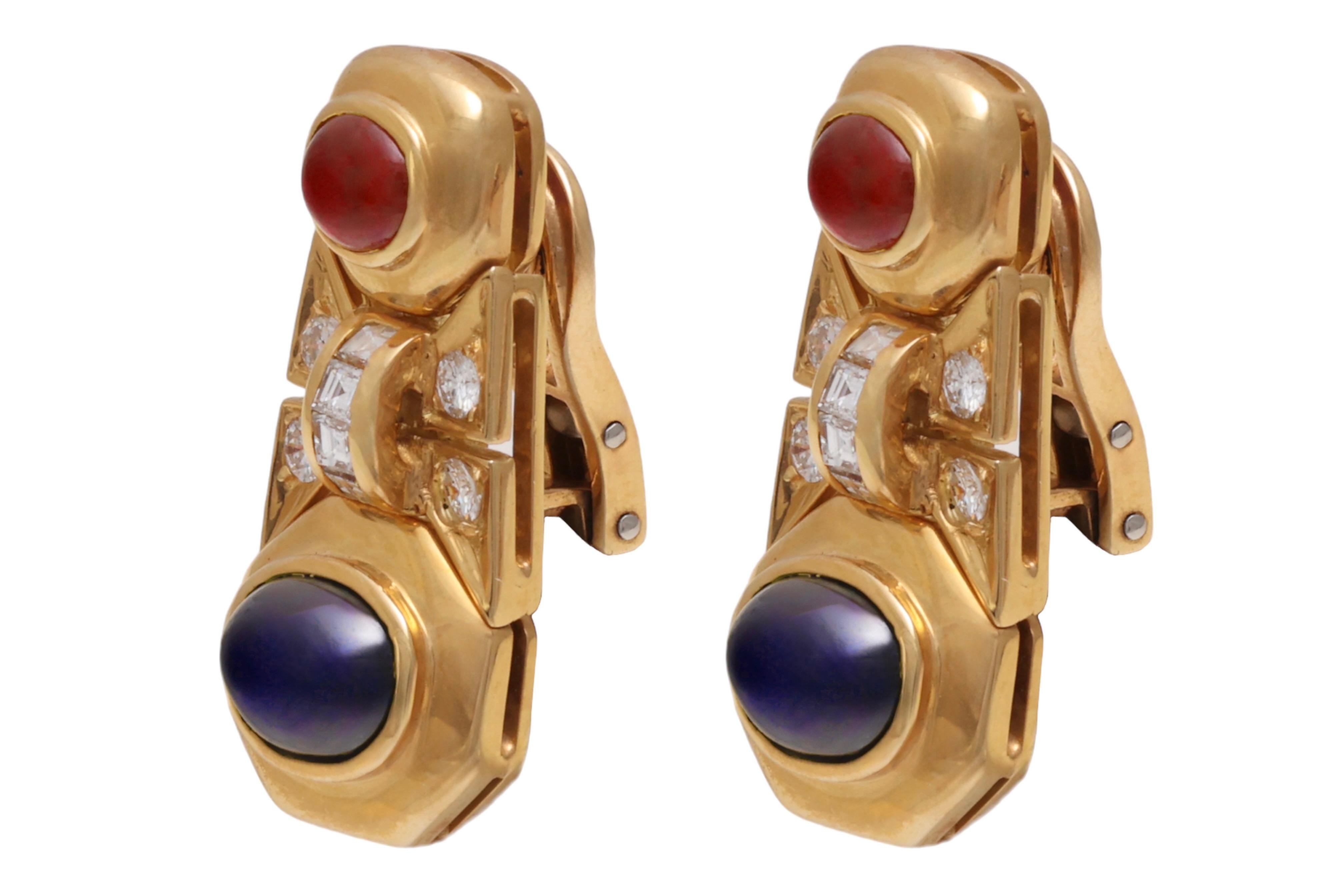 Gorgeous 18 kt. Yellow Gold Clip-On Earrings With Cabochon Sapphire and Ruby and Diamonds 

Ruby: 2 cabochon cut rubies

Sapphire: 2 cabochon Sapphires

Diamonds: Brilliant cut and square cut diamonds together 0.72 ct.

Material: 18 kt yellow