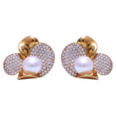 Boucles d'oreilles à clip en or jaune 18 carats avec diamants et perle d'Akoya
