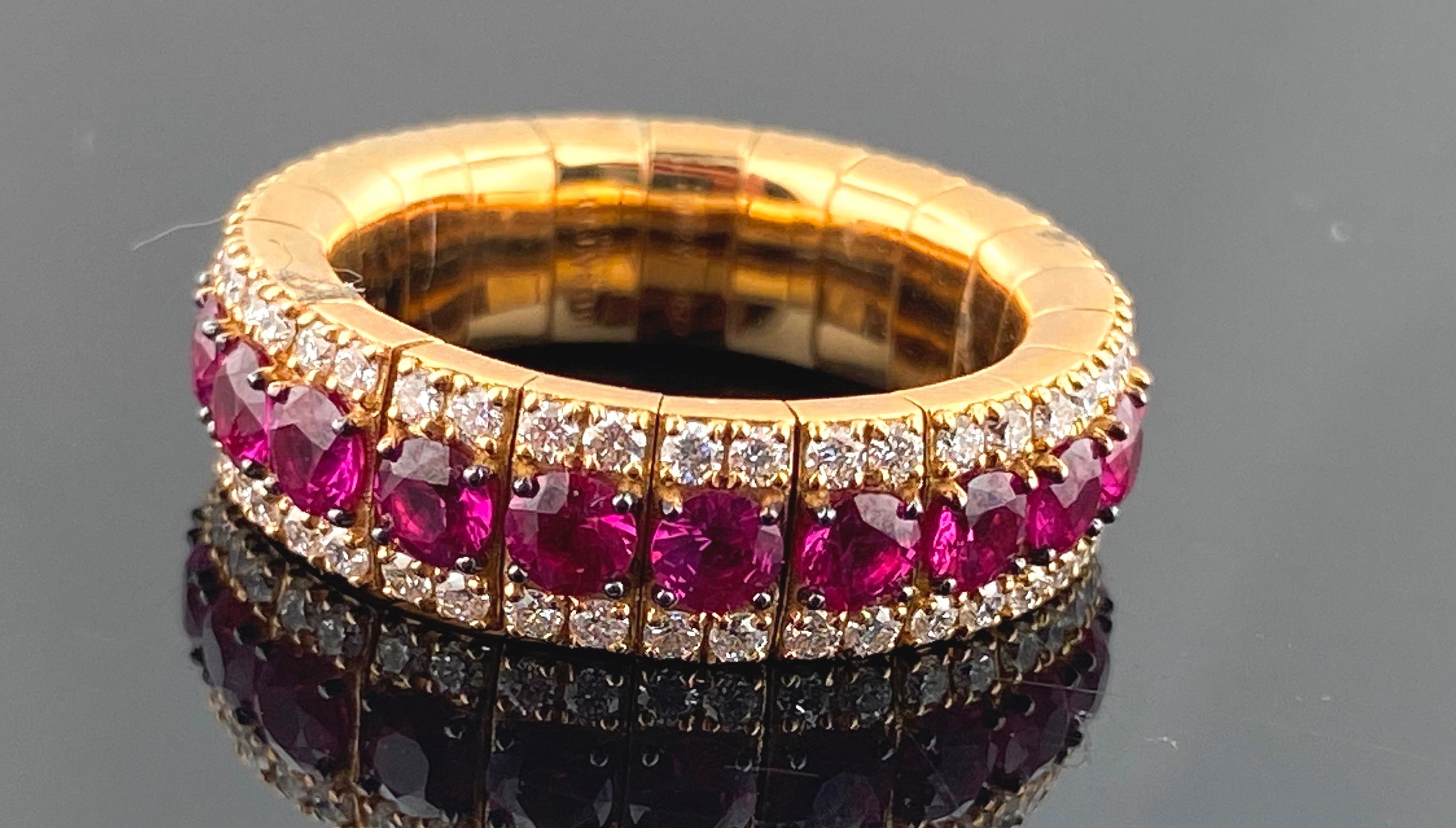 Set in 18 karat yellow gold are 21 round cut Rubies with a total weight of 3.09 carats, with 84 round brilliant cut diamonds with a total weight of 0.93 carats.  This is an expandable and stackable Ring.  Ring size is 6.50.