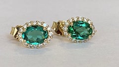 Green Tourmaline and  Diamond earrings studs in 18 kt yellow gold