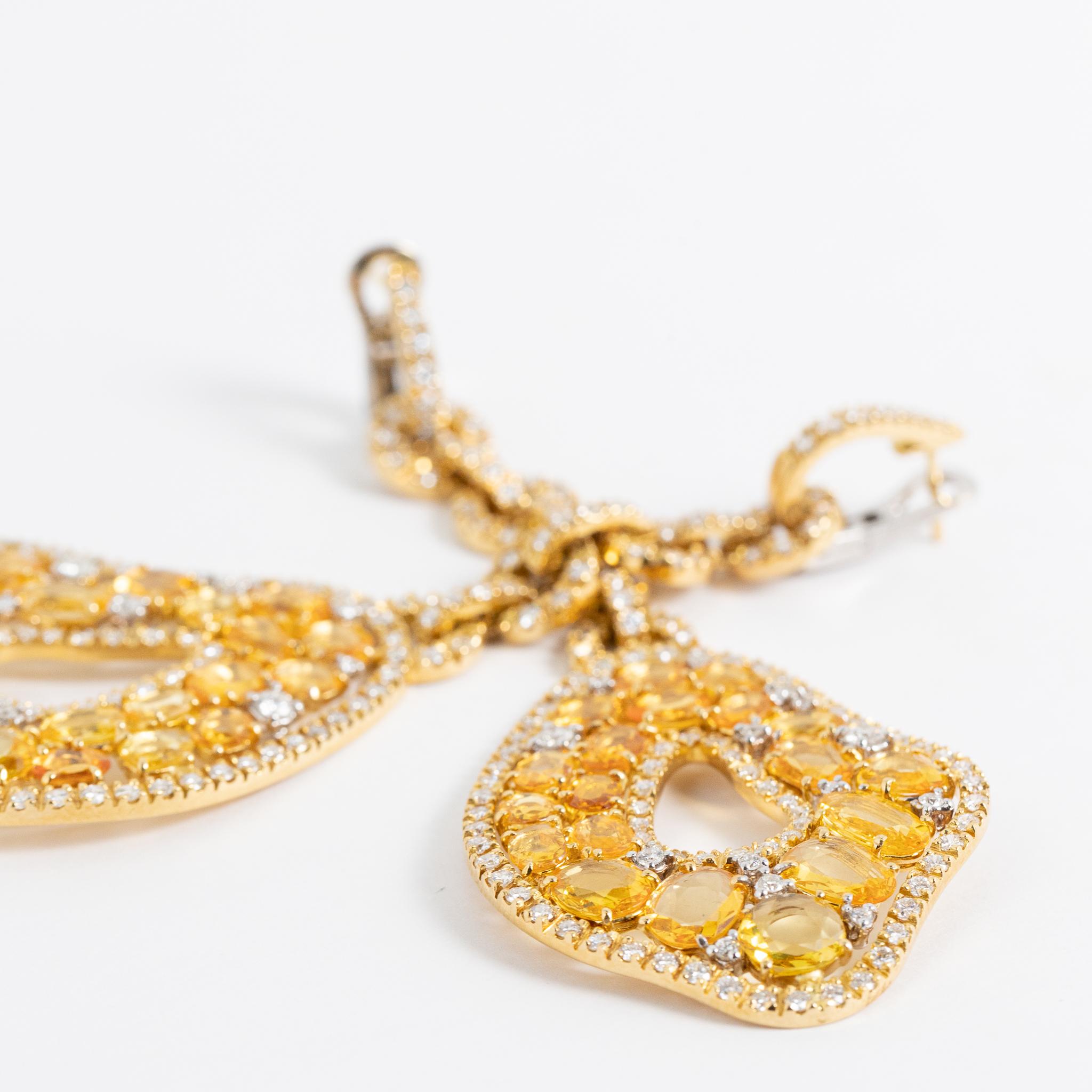 18 kt. yellow gold earrings with diamonds and yellow sapphires.
This exceptional pair of earrings is hand-made in Italy, signed by Fraleoni.
Fraleoni is a jewelry brand located in Rome, Italy.
One of a kind piece.
2010

Round cut Diamonds: 5.90 cts.