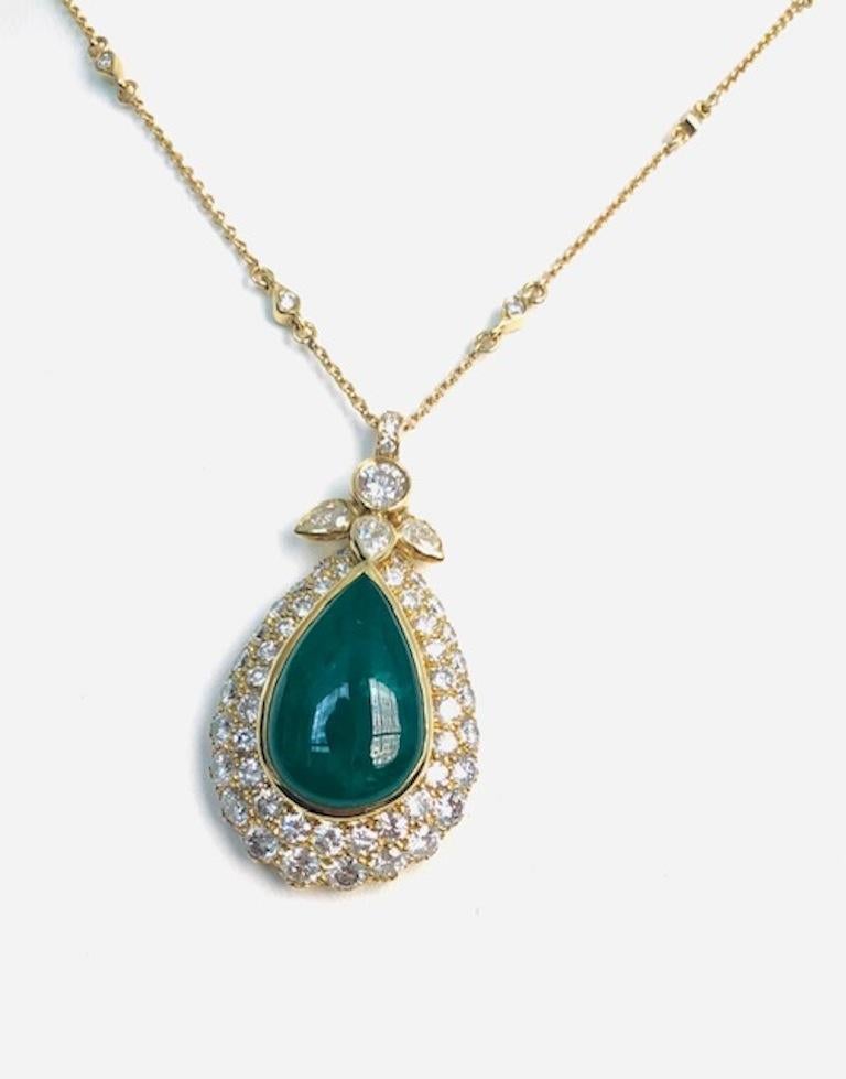 Great looking Pear Drop design Pendant set with 78 Diamonds 5.91 carats and a Cabochon Emerald 12.00 carats.
The rolled shape of the Pendant is totally covered with Diamonds!
Pendant Length is 1-1/2