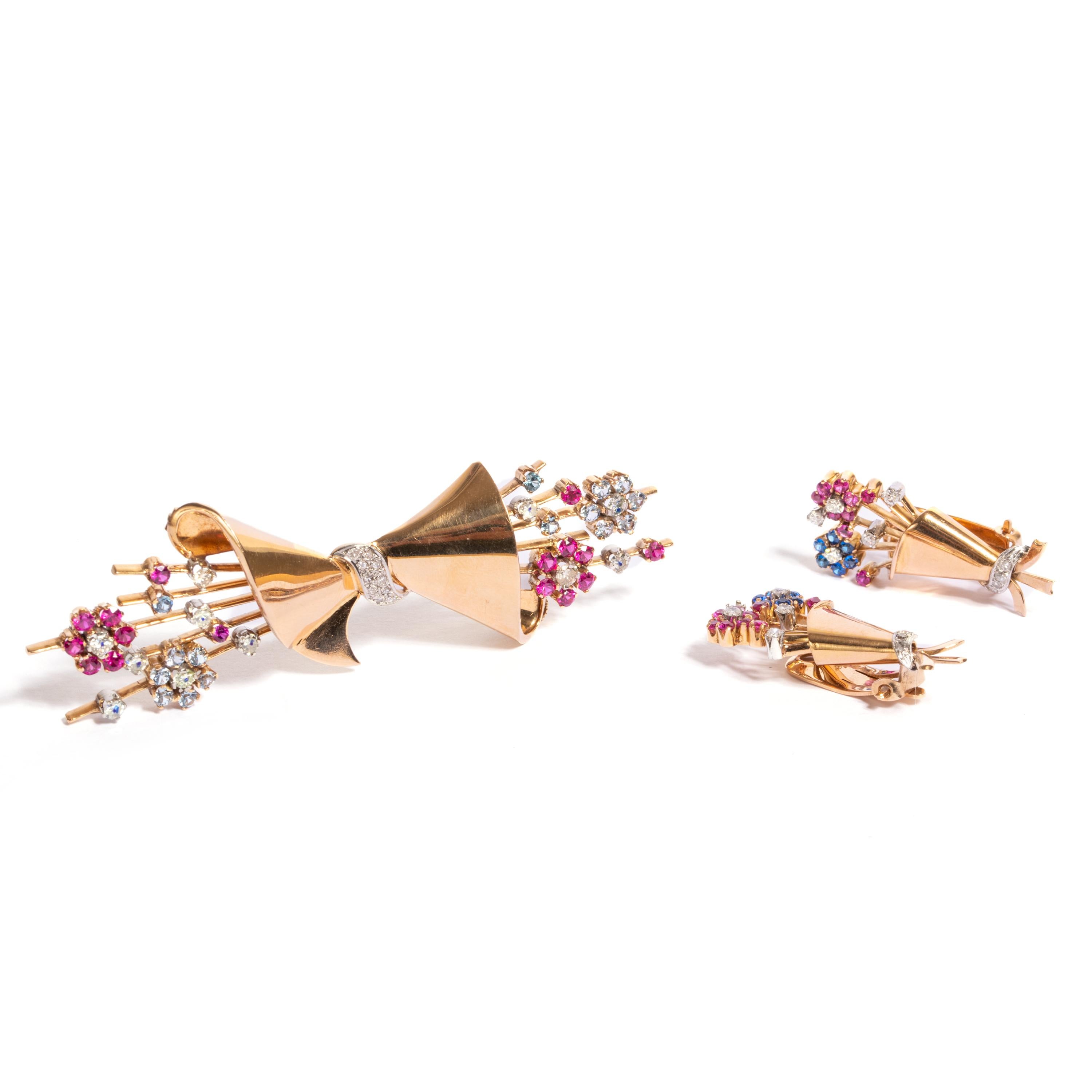 Parure 18 Kt gold brooch and earrings, Italian manufacture, 1940s.Beautiful bouquet design decorated with gemstones. 
brooch size: 10 cm x 2,5 cm
earrings size 4 cm x 1,5 cm 
40 gr
