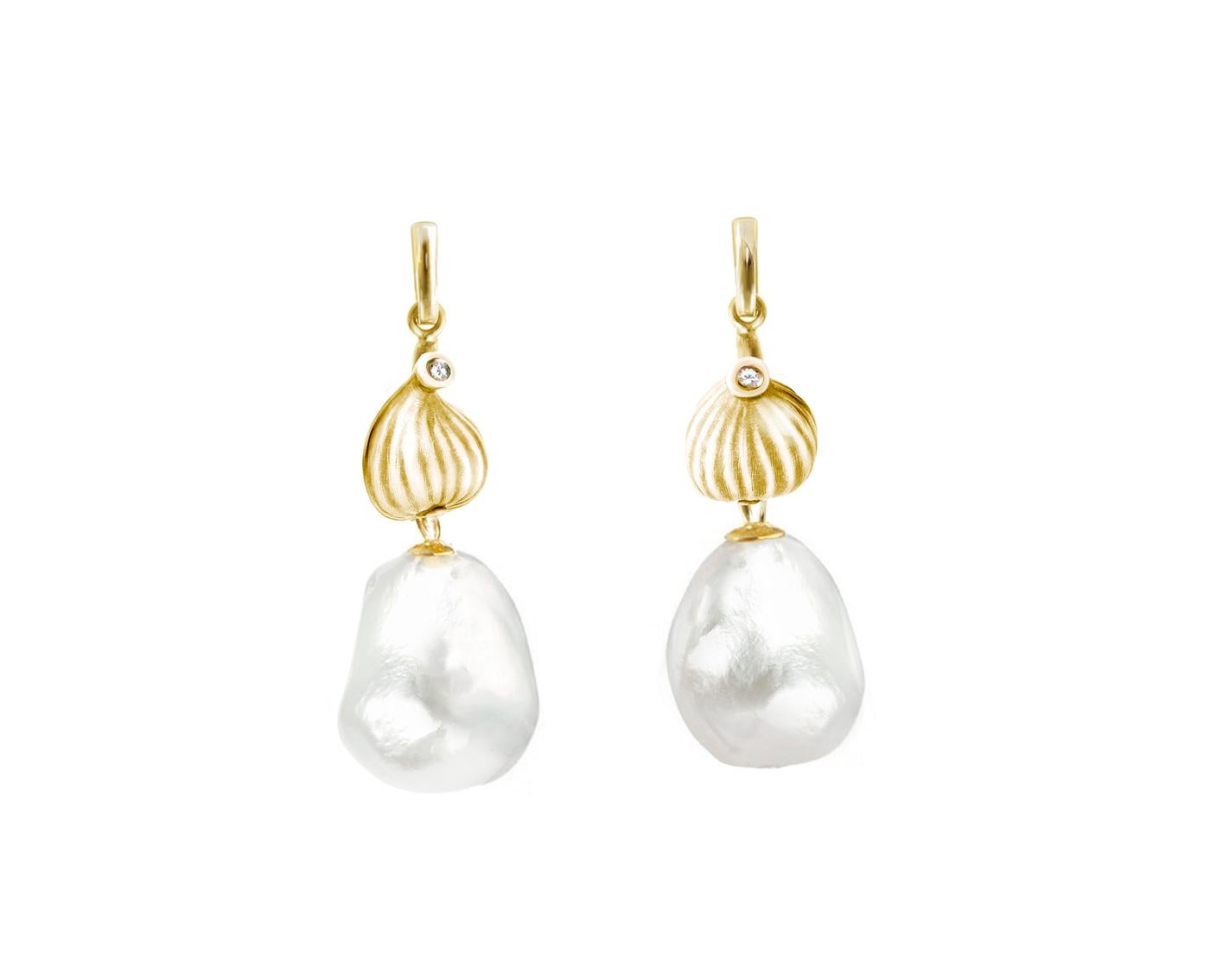 These contemporary Fig drop earrings are crafted from 18-karat yellow gold, adorned with a freshwater baroque pearl and two diamonds. They have been featured in a review by Vogue UA. We use only top-quality natural diamonds, VS and F-G, and work