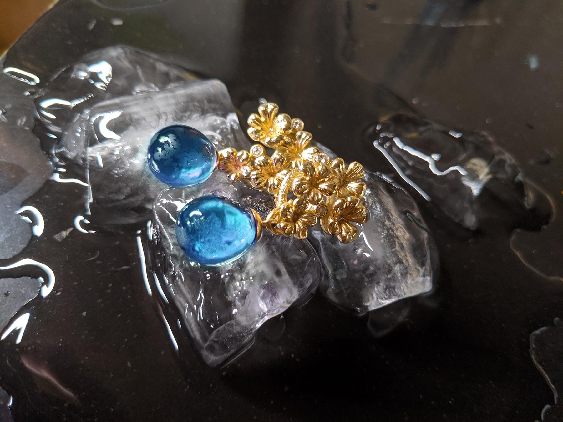The Plum Flowers contemporary jewelry collection was featured in Vogue UA review and designed by oil painter from Berlin, Polya Medvedeva.

These clip-on earrings are made of 18 karat yellow gold and encrusted with 6 round diamonds and cabochon blue