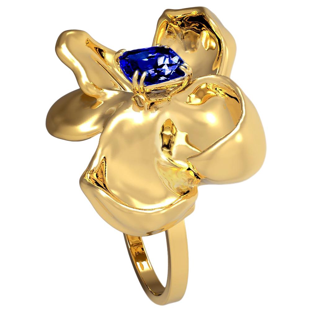 The Magnolia Flower contemporary ring is crafted from 18 karat yellow gold and features a GRS certified no heat royal blue sapphire with a weight of 1.03 carats. The sapphire has a cushion cut and measures 6.97 x 5.09 x 2.84 mm, exhibiting an