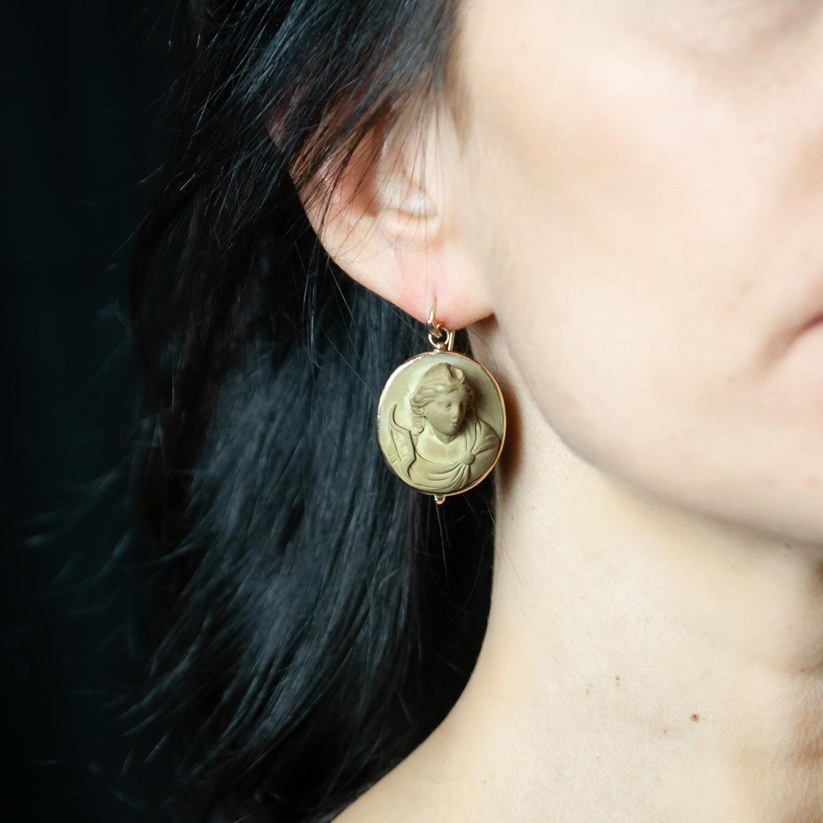 18 kt yellow gold earrings made in our workshop by Italian goldsmith masters, with 2 antique lava stone cameos plaques from around 1890, depicting two ladies with collected hair and jewels.
An ancient jewel is much more than its intrinsic value, in