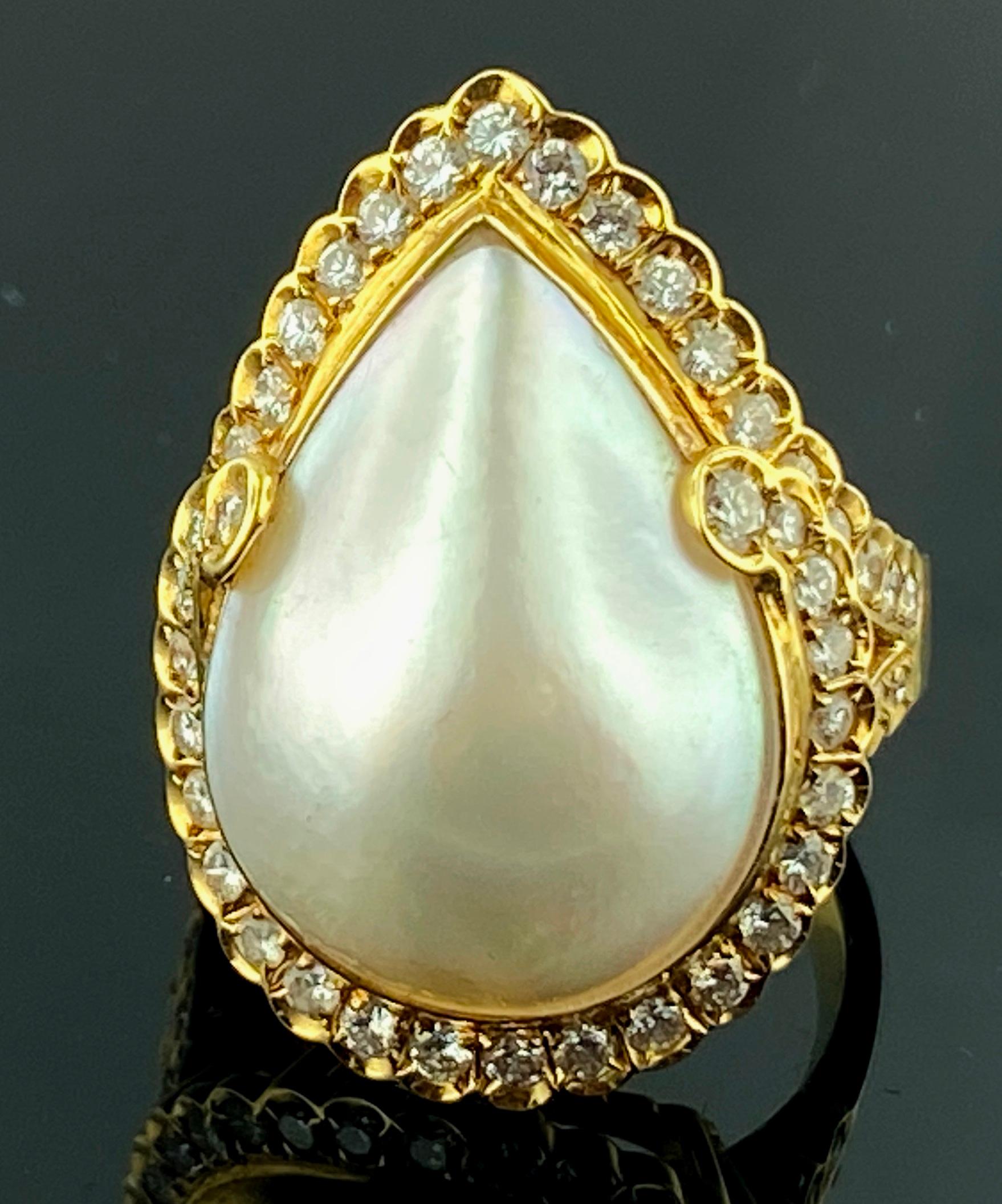 Set in 18 karat yellow gold is a pear shaped Mabe Pearl with 50 round brilliant diamonds with a total diamond weight of 0.75 carats.  Ring size is 6.25.  Gold weight is 9 grams.