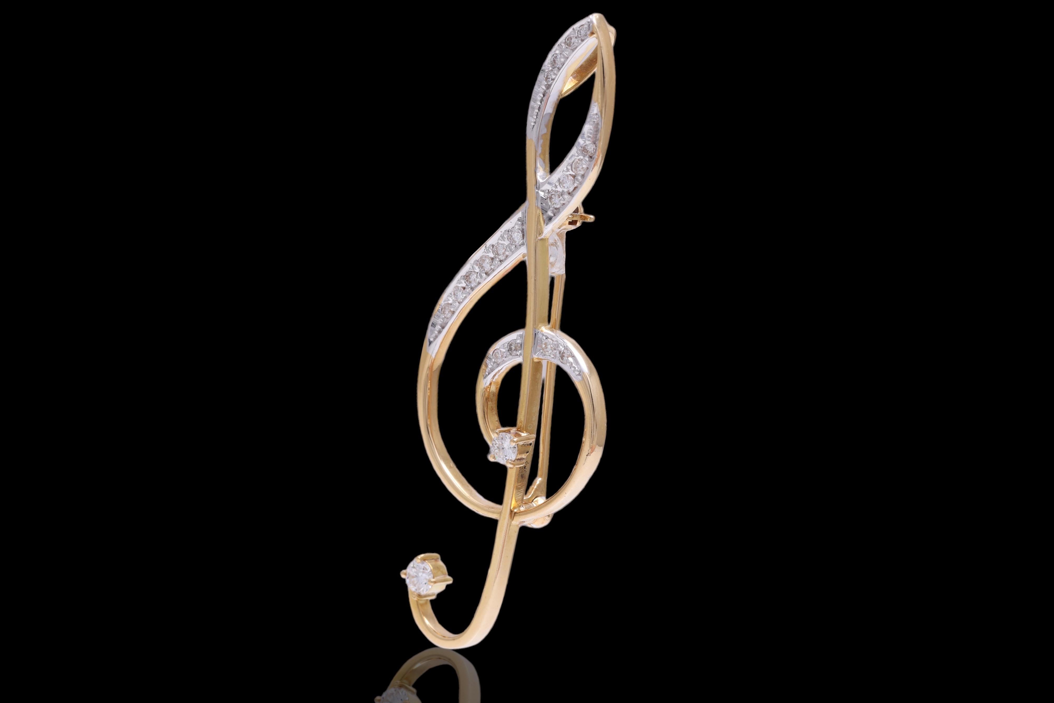 Beautiful 18 kt. yellow gold Brooch / Pendent-Hanger with 0.48 ct. diamonds in the shape of a music note 

Can be worn as a Brooch or with adding a chain as  a Pendant !
Completely hand made.

Diamonds : Brilliant cut diamonds, together 0.48