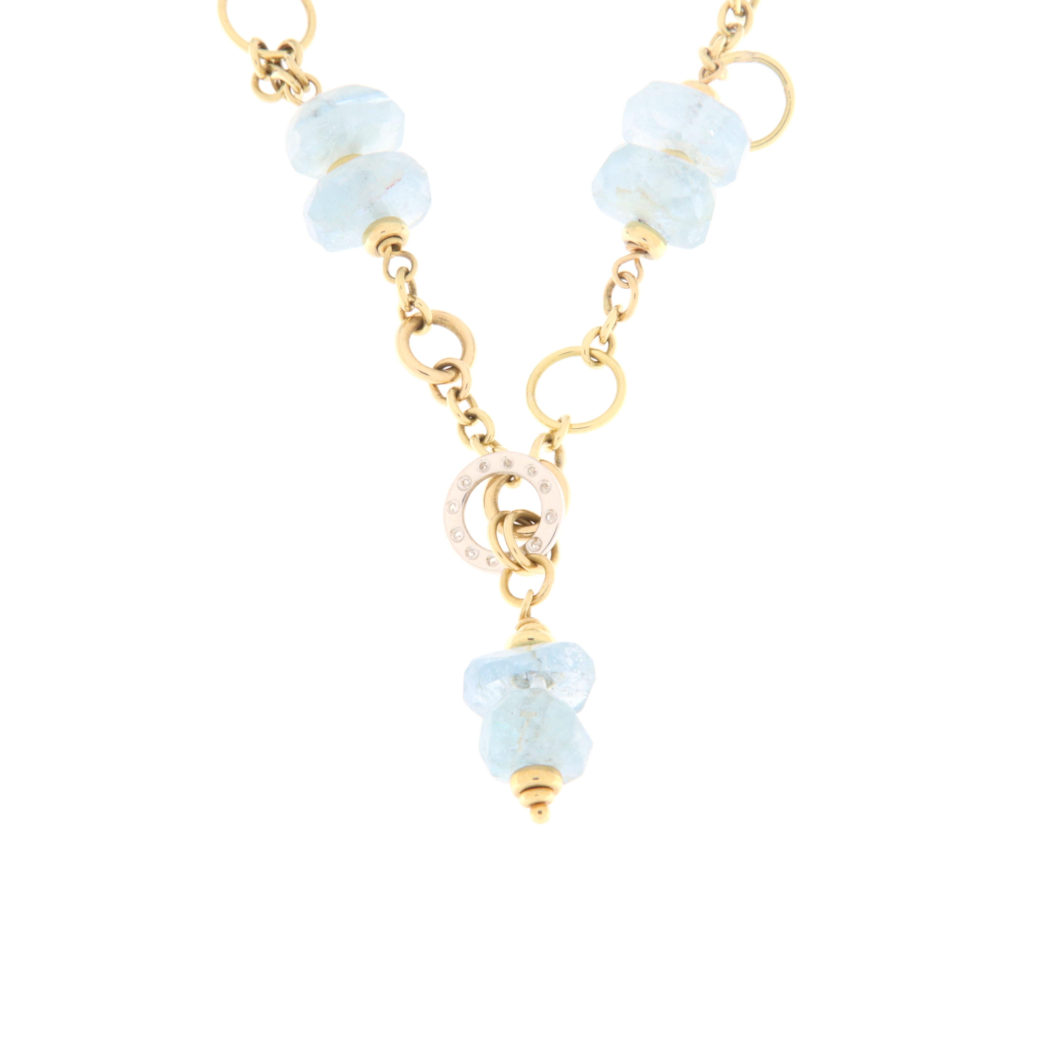 Yellow gold choker embellished with faceted aquamarine rondels and small diamonds. The central part of the necklace is formed by a double of aquamarine stones and a gold circle with diamonds. The length of the necklace is 50 cm. with the addition of
