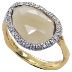 18 kt yellow Gold Ring with Multifaceted Oval Citrine Quartz & Diamonds