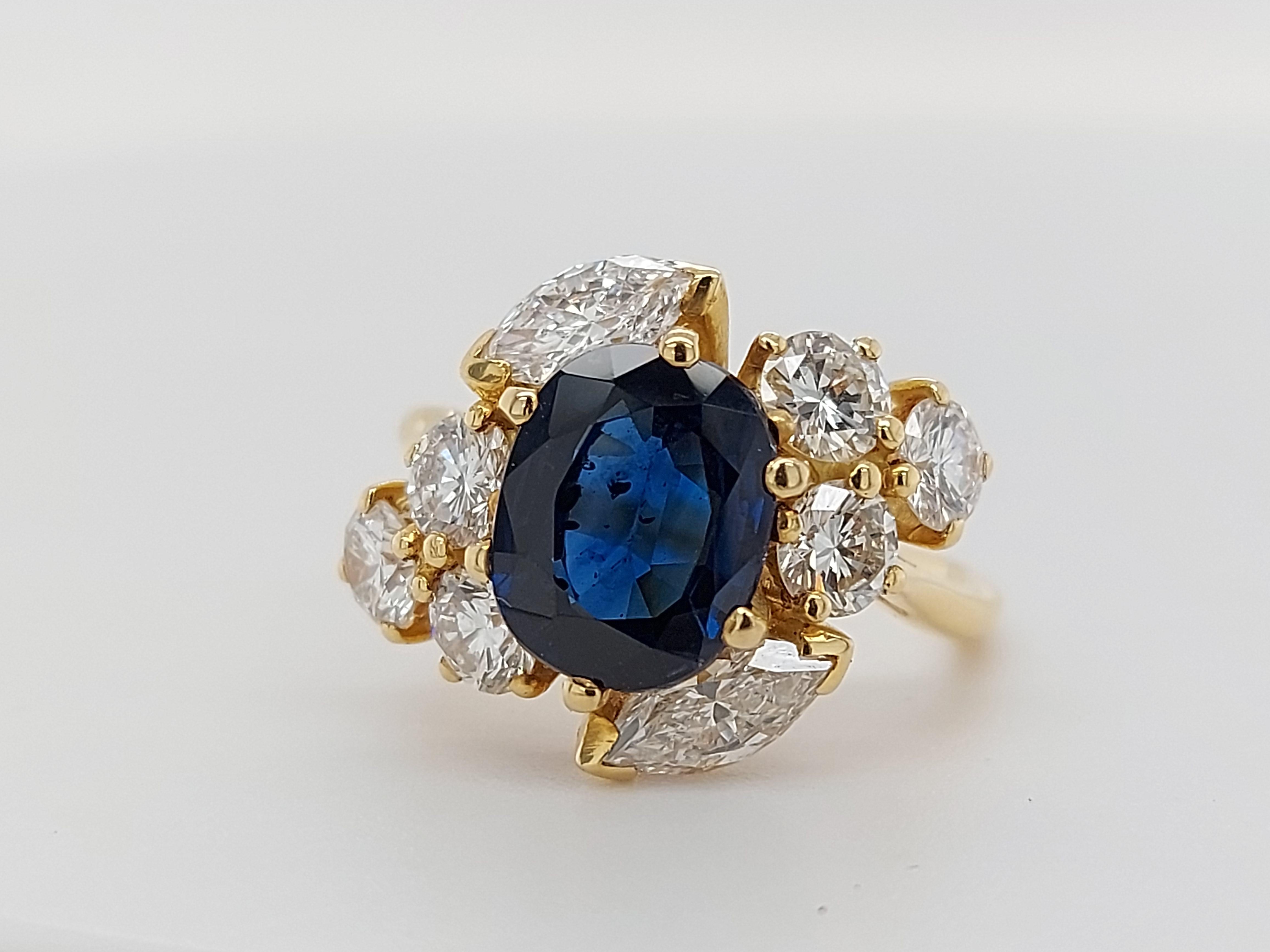 18 Karat Yellow Gold Ring with Oval Sapphire, Marquise and Round Cut Diamonds 6