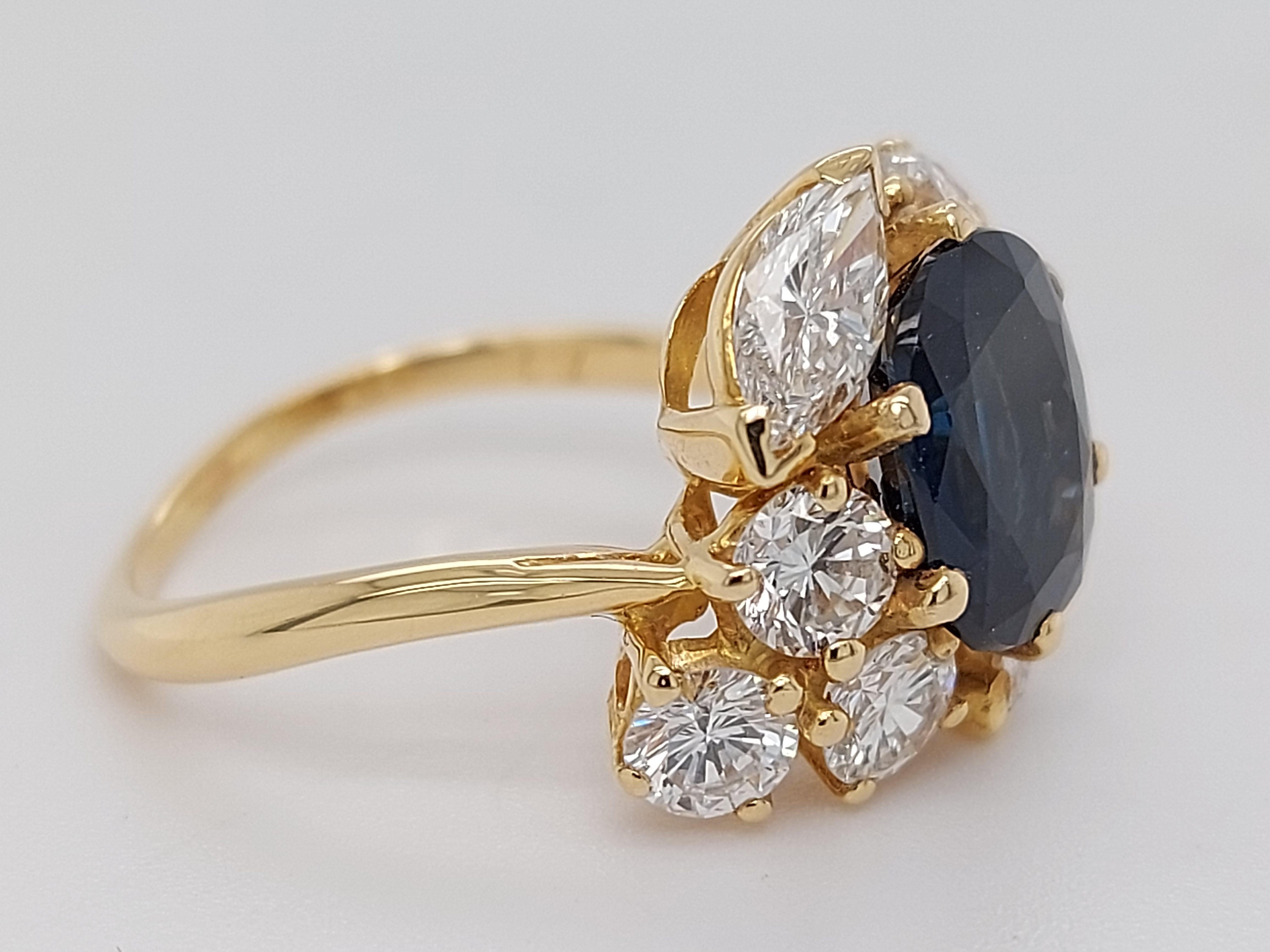 18 Karat Yellow Gold Ring with Oval Sapphire, Marquise and Round Cut Diamonds 7