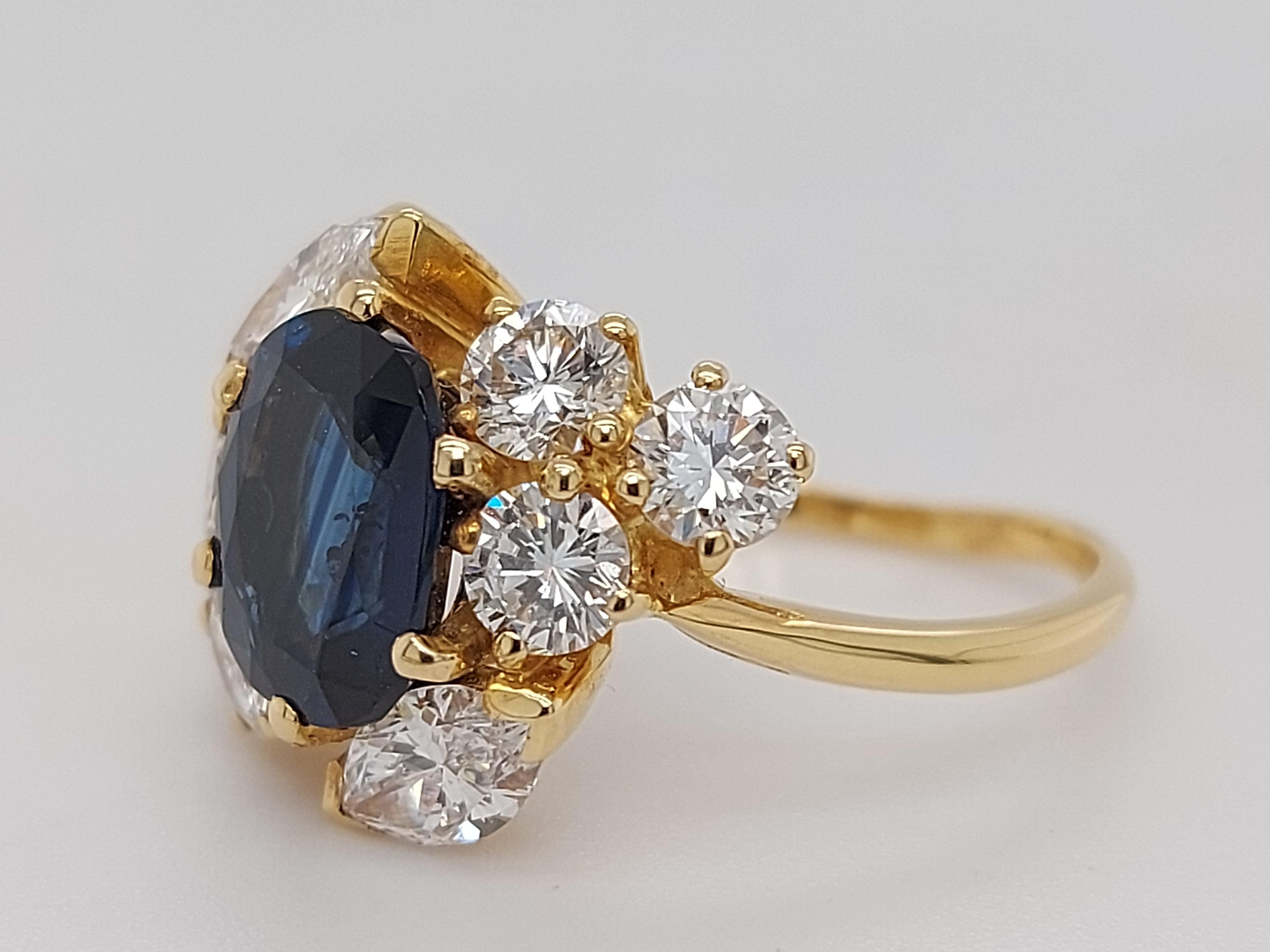 18 Karat Yellow Gold Ring with Oval Sapphire, Marquise and Round Cut Diamonds 8