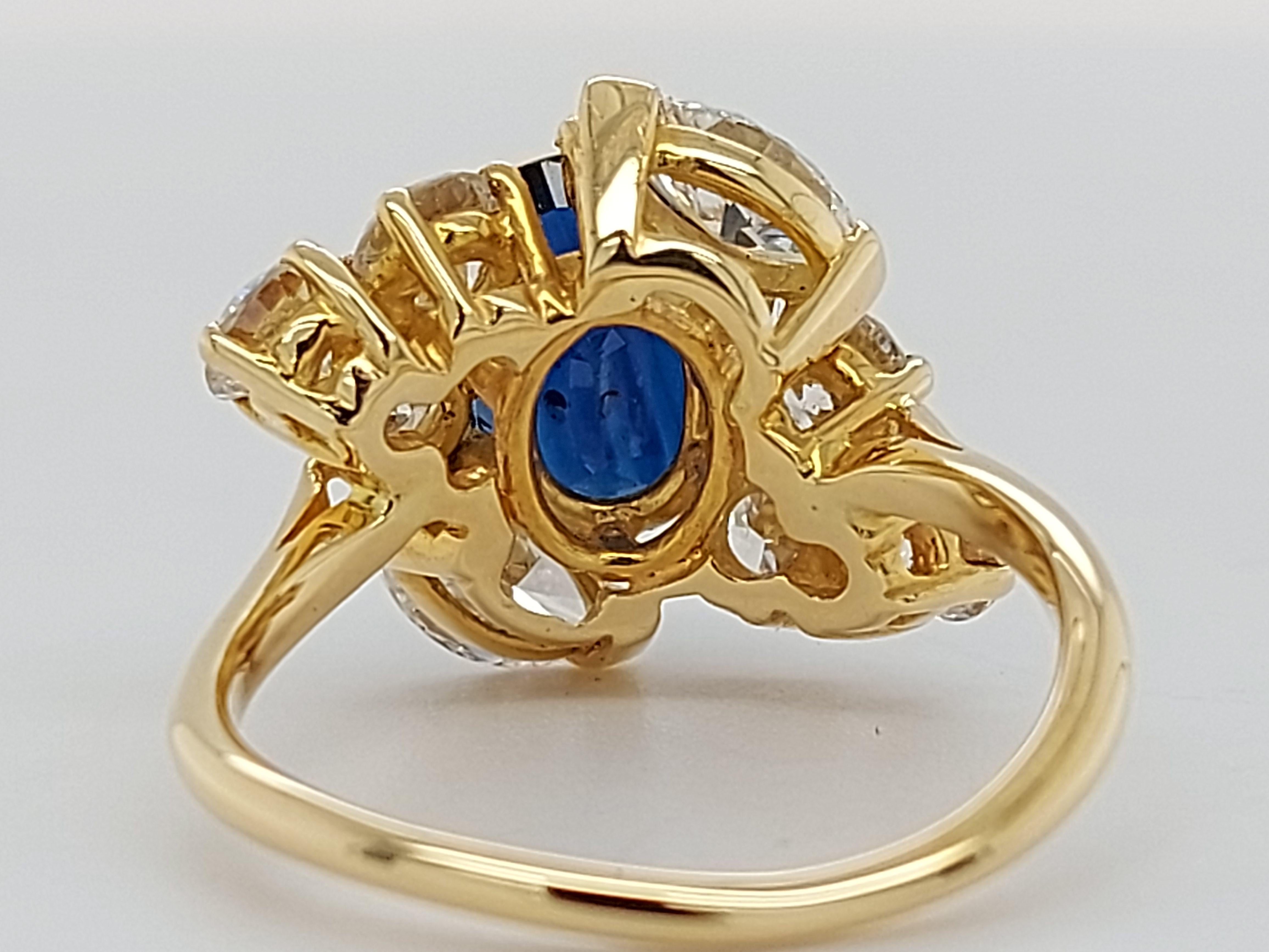 18 Karat Yellow Gold Ring with Oval Sapphire, Marquise and Round Cut Diamonds 9