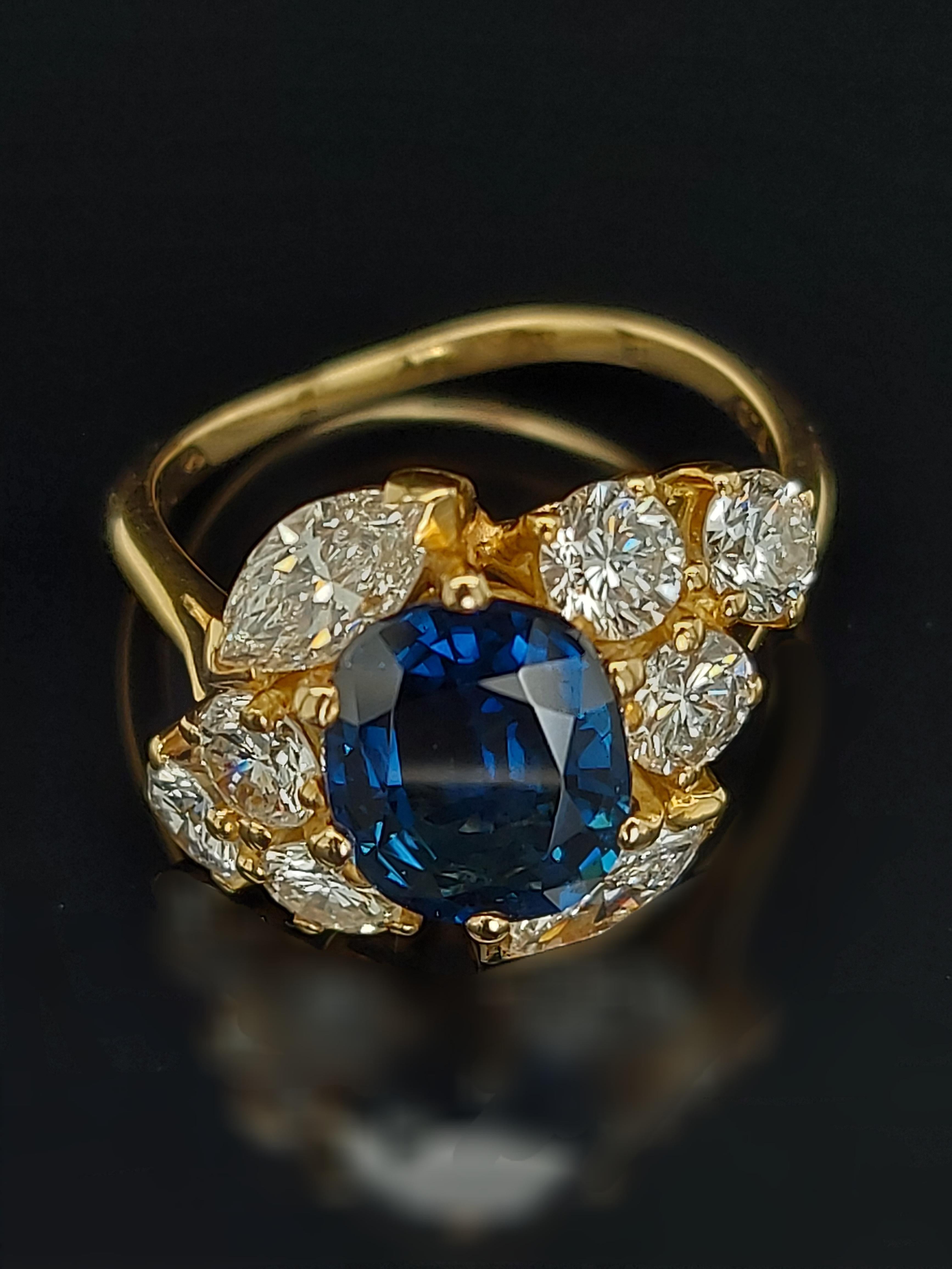 18 Karat Yellow Gold Ring with Oval Sapphire, Marquise and Round Cut Diamonds 10