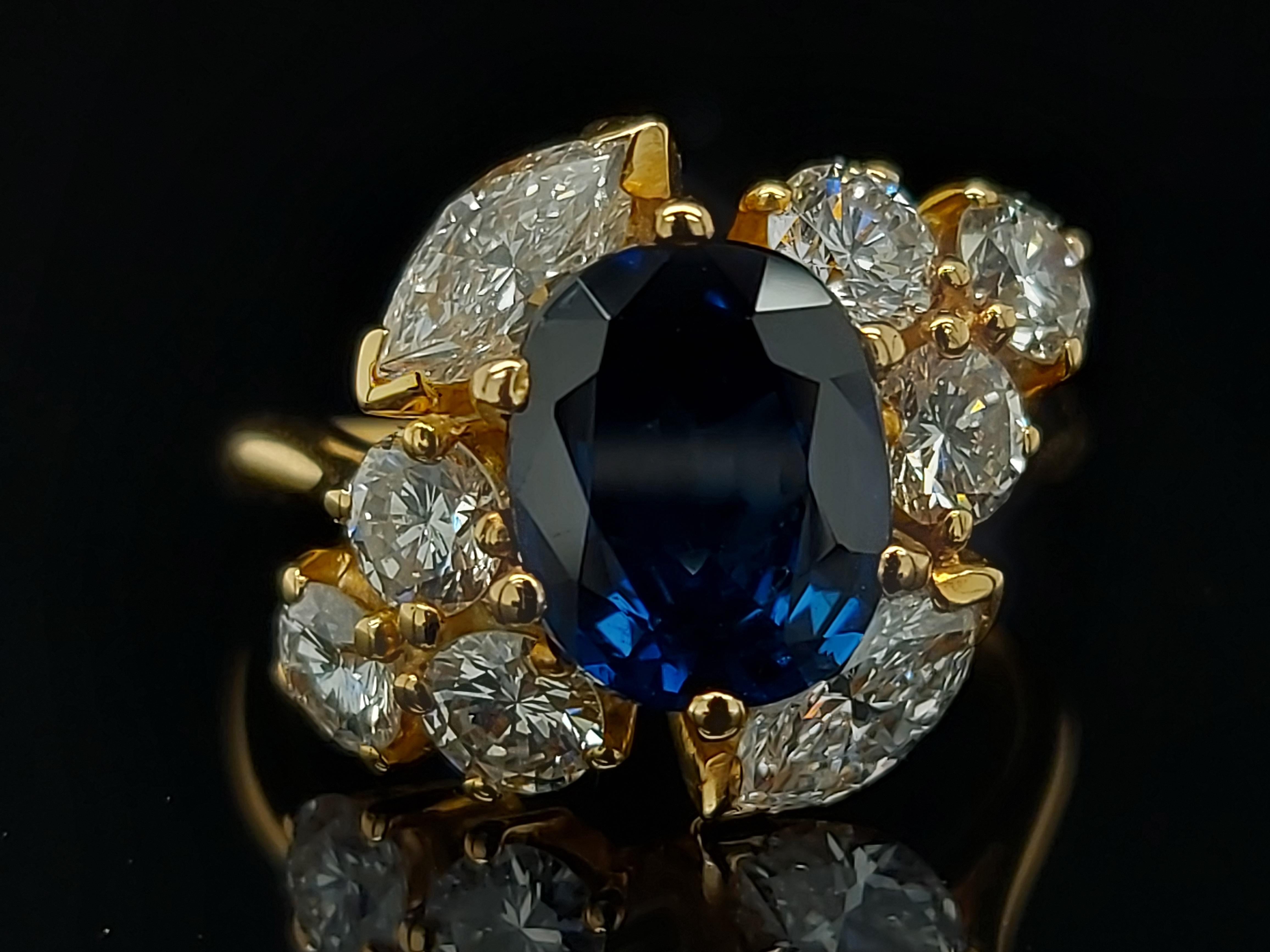 18 Karat Yellow Gold Ring with Oval Sapphire, Marquise and Round Cut Diamonds 11