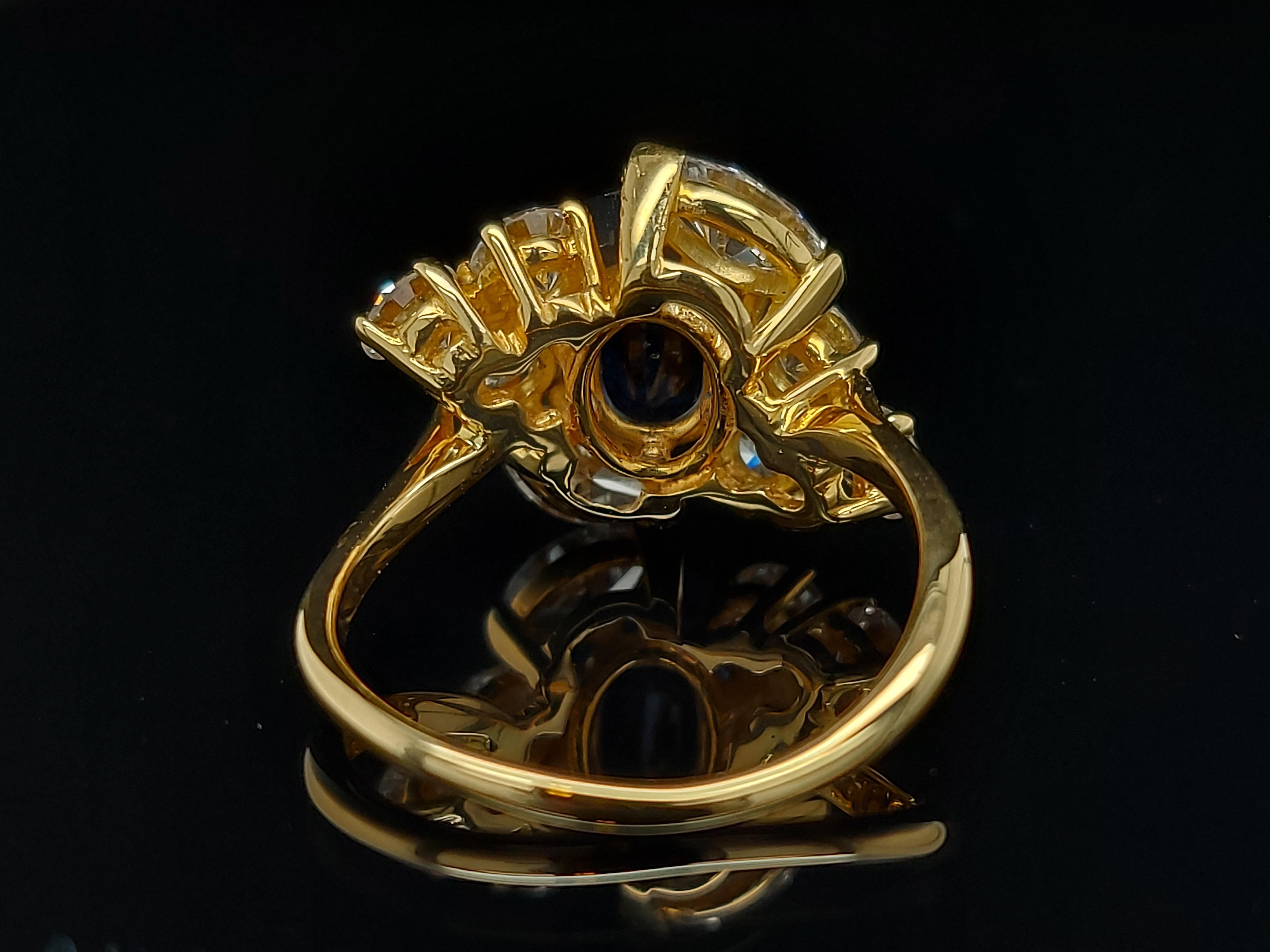 18 Karat Yellow Gold Ring with Oval Sapphire, Marquise and Round Cut Diamonds 12