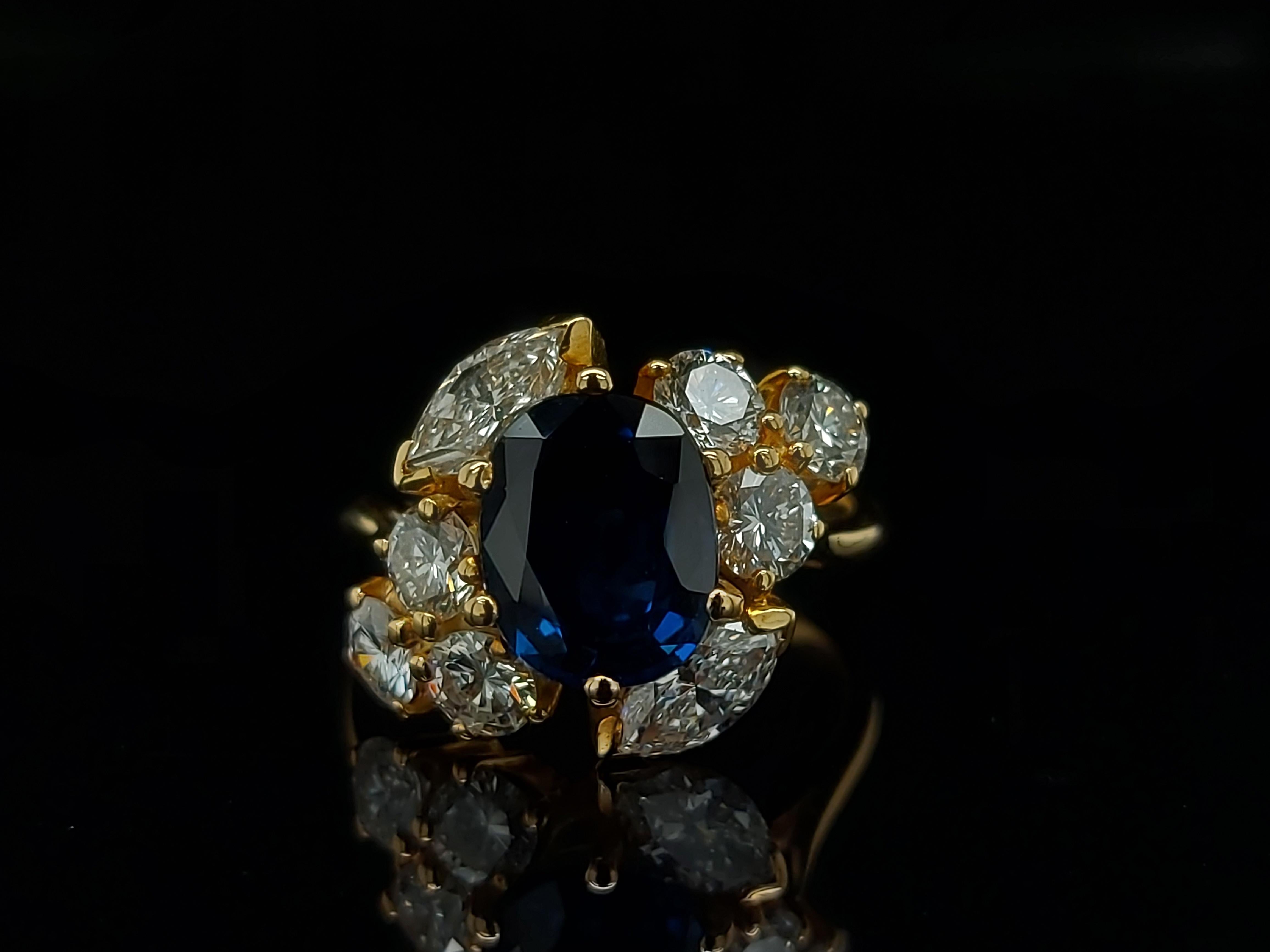 18 Karat Yellow Gold Ring with Oval Sapphire, Marquise and Round Cut Diamonds 13