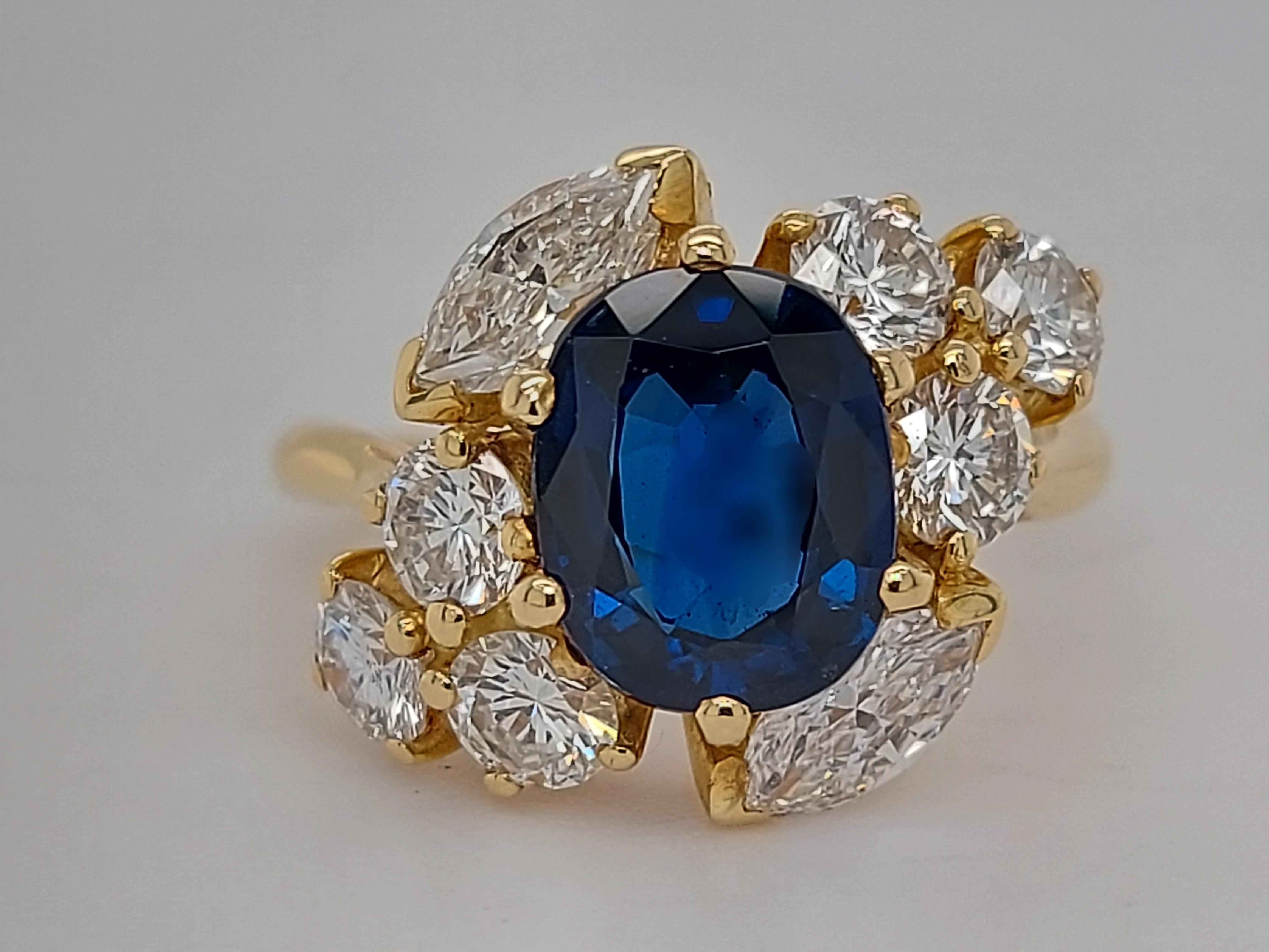 Stunning 18 kt Yellow Gold Ring With Oval Sapphire, Marquise & Round Cut Diamonds

Sapphire:  2.42 ct 

Diamonds: 2 Marquise and 6 round cut diamonds together approx 1,8 ct of beautiful color and clarity

Material: 18 kt yellow gold

Ring Size: 52 (
