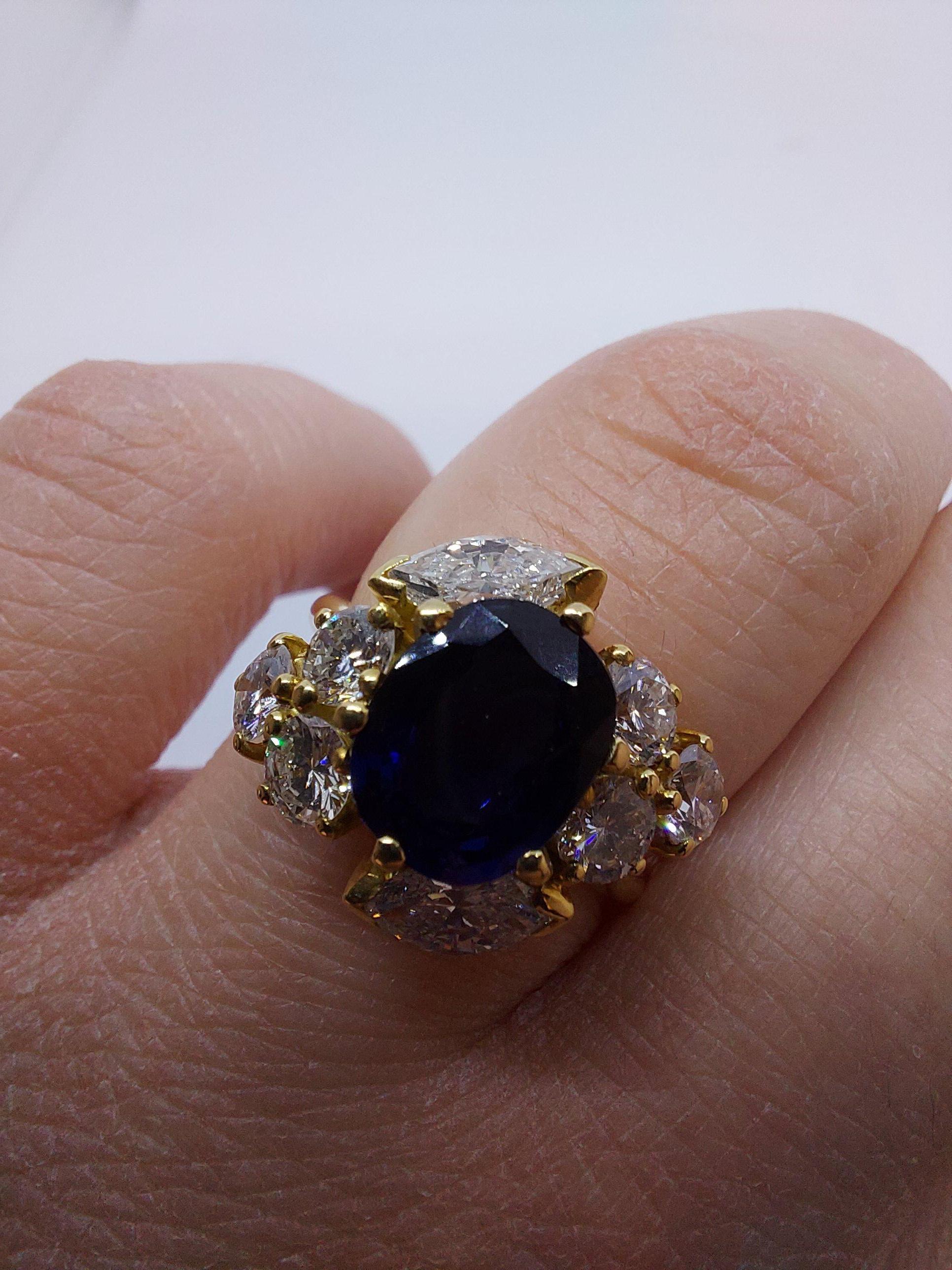 18 Karat Yellow Gold Ring with Oval Sapphire, Marquise and Round Cut Diamonds 15