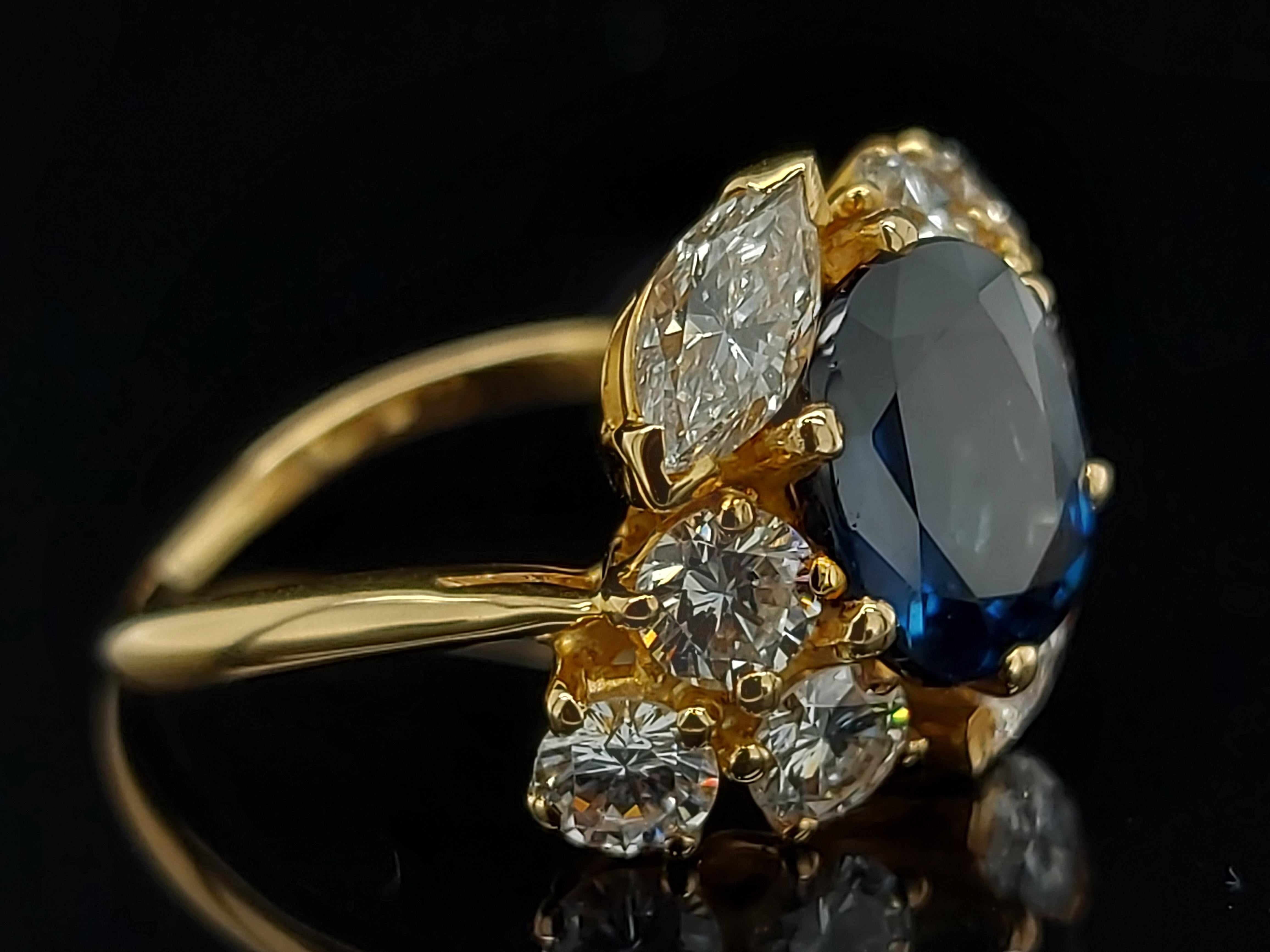 Artisan 18 Karat Yellow Gold Ring with Oval Sapphire, Marquise and Round Cut Diamonds