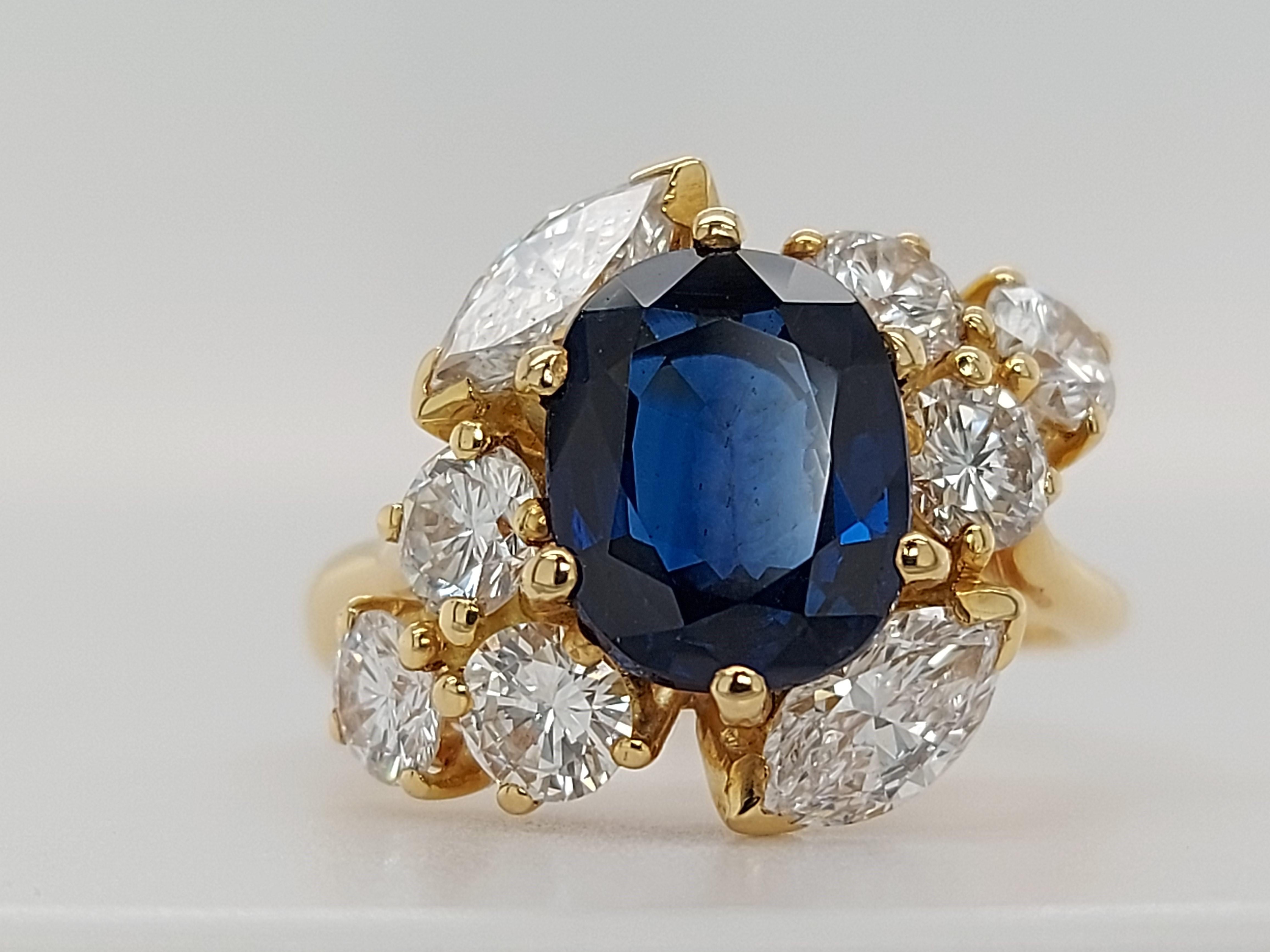 18 Karat Yellow Gold Ring with Oval Sapphire, Marquise and Round Cut Diamonds 1