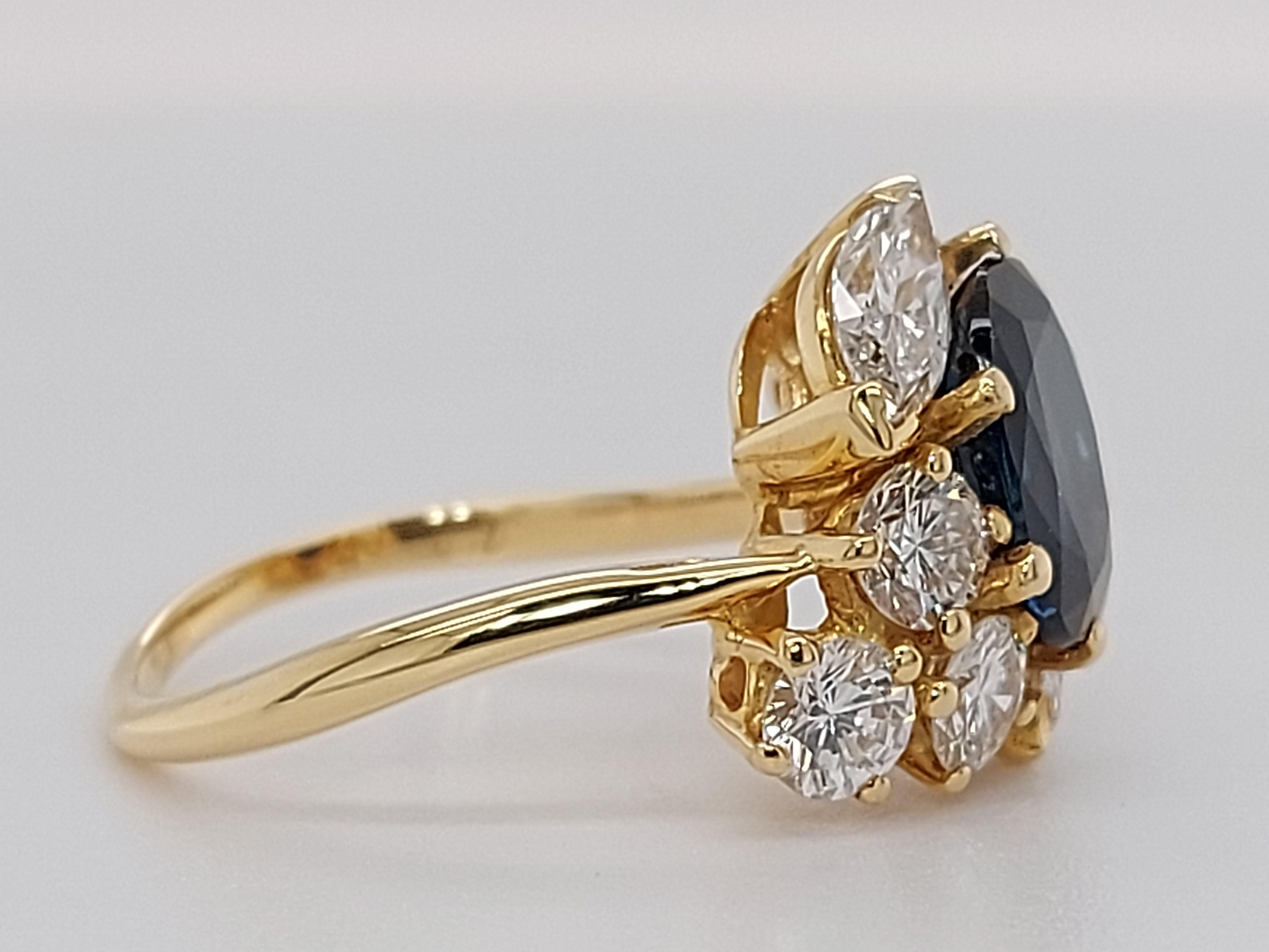 18 Karat Yellow Gold Ring with Oval Sapphire, Marquise and Round Cut Diamonds 4