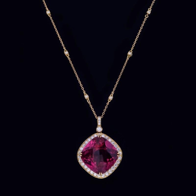 Fabulous 18 Kt Yellow Gold Pendant/Necklace, made especially for this unusually large red Rubellite of 27.90 carats, set with 89 round diamonds 2.50 carats.
Note: Rubellite material of this color and size are is a rare occurrence. 

We design and