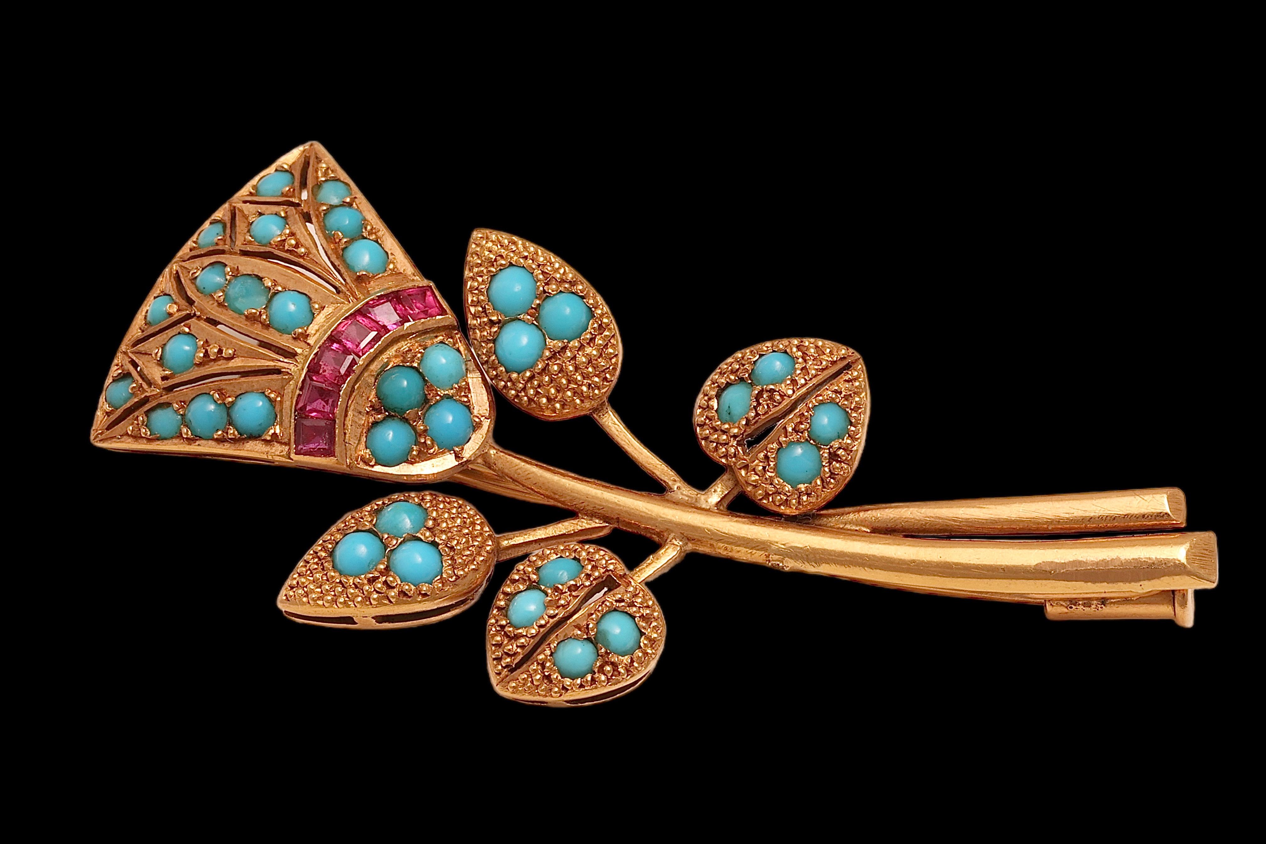 18kt. Yellow Gold Vintage Tulip Brooch which can also be used as a Pendant With Ruby &Turquoise 

Ruby: 6 calibrated square natural rubies

Turquoise: 33 turquoise stones

Material: 18 kt. Yellow gold

Measurements: 54.4 mm x 23.1 mm x 8.9 mm

Total