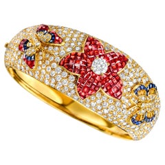 18 kt. Yellow Gold Wide Bangle Bracelet With Diamonds, Rubies, Sapphires
