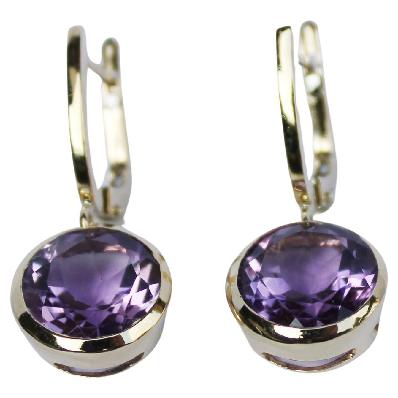 Earrings in yellow gold 18 Karat with Amethyst (round cut, size: 10 mm)

All Stanoppi Jewelry is new and has never been previously owned or worn. Each item will arrive at your door beautifully gift wrapped in Stanoppi boxes, put inside an elegant