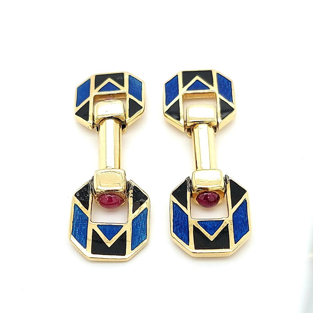 18kt Yellow Golden Blue & Black Enamel Cufflinks With Ruby stones 

Stamped with MV,and you can see on the enamel the signs M and V as well.

I can t find which brand handcrafted those beautiful cufflinks ,but they re very nice.

Ruby: 4 round ruby