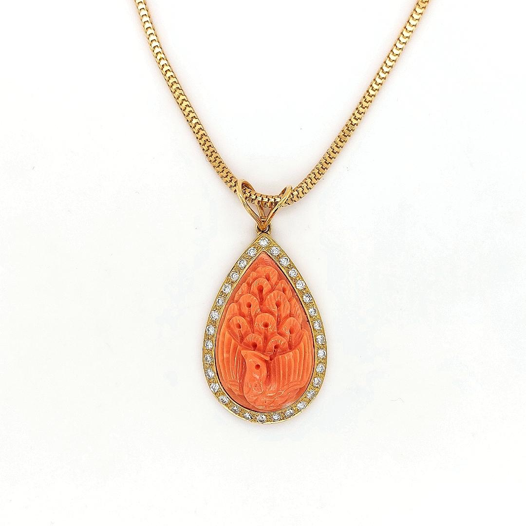 18 kt Yellow Golden Necklace With Hand Carved Coral Pendant And 0.70 Carat Diamonds

Diamonds: 30 brilliant cut diamonds, together 0.70 ct

Material: 18 kt yellow gold

Total weight: 19.3 grams / 0.680 / 12.4 dwt

Measurements: String 45 cm long,