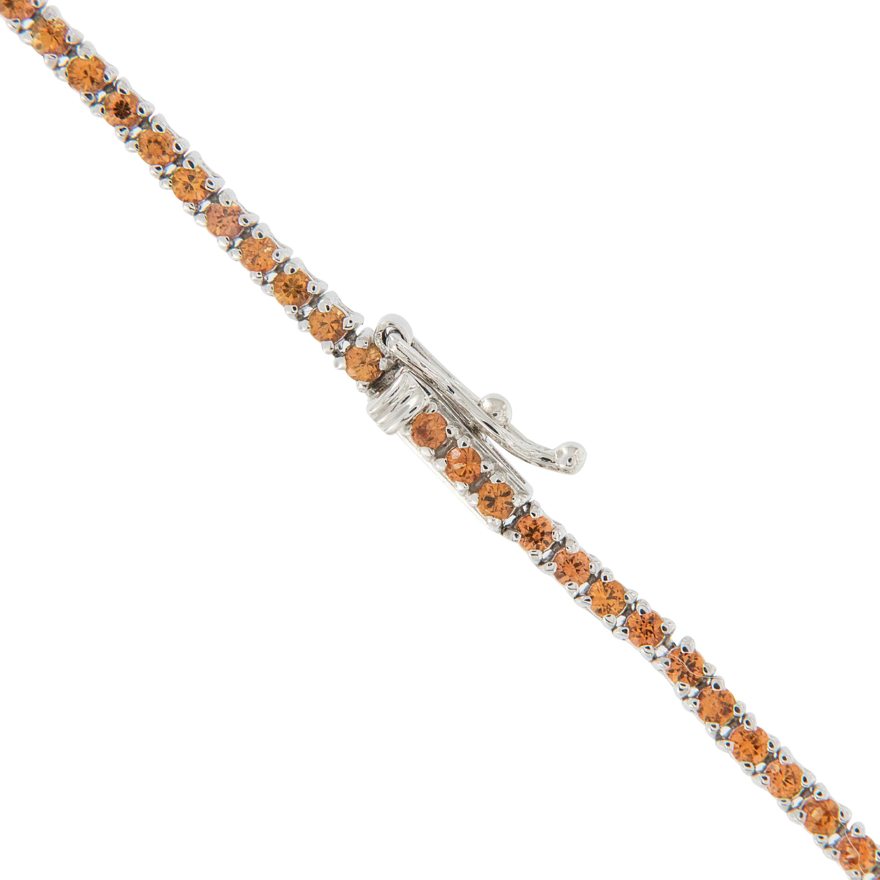Sunny, warm hues of rare Golden South Sea pearls & orange sapphires bring to mind the weather of the tropical regions they come from. Two Gem Golden pearls (10-14mm) drop from the center in offset fashion with the orange sapphires (3.94 Cttw)