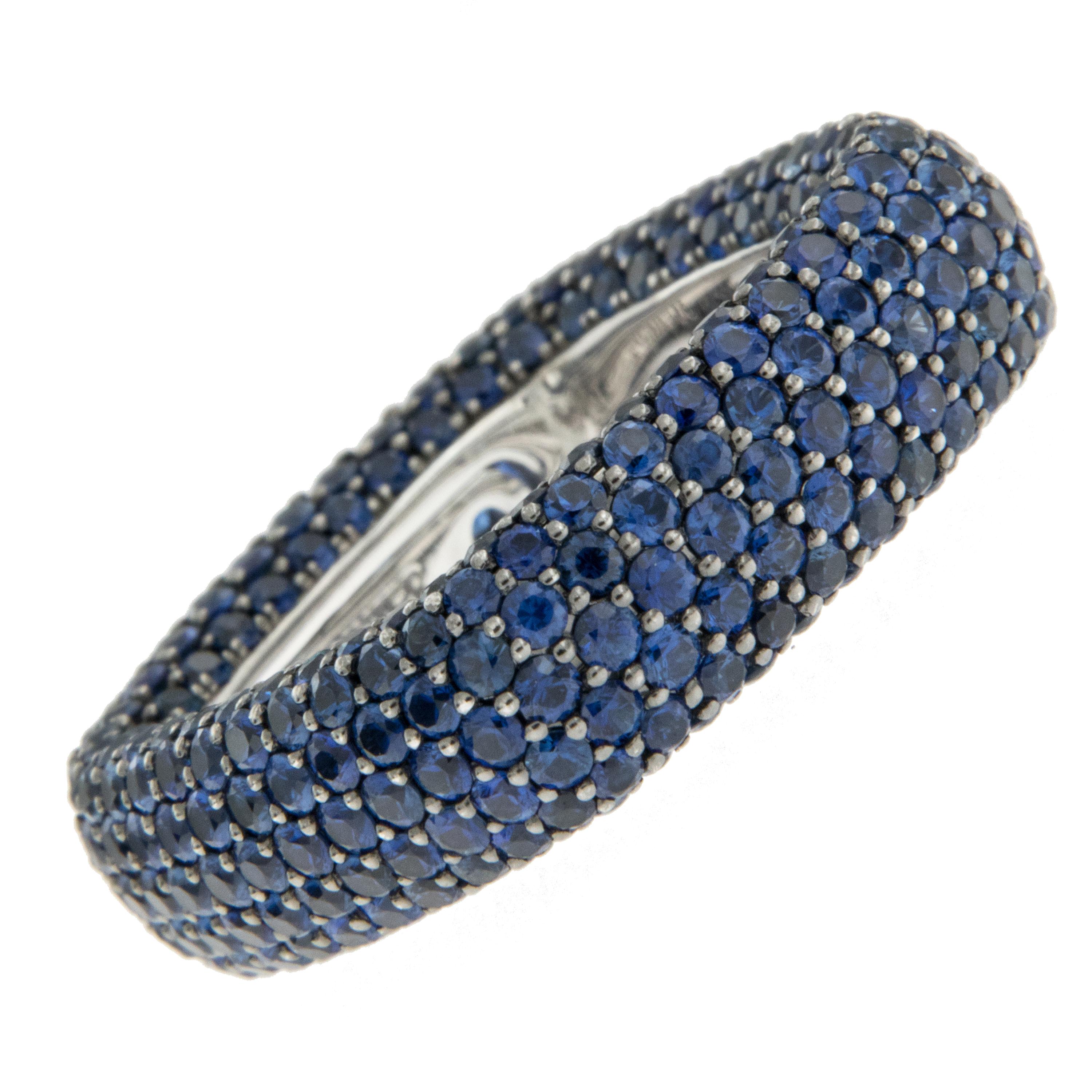 18 KWG beautifully and uniquely designed pave Blue Sapphire square ring. This ring is set with over 6 cttw faceted Blue Sapphires wrapped in a square design with a natural feeling on the skin. This exquisite square design has a sizing feature