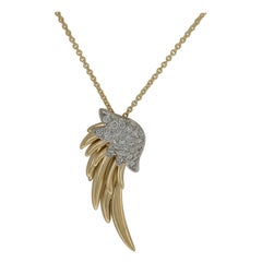 18 KYG Tiffany & Co. Schlumberger Diamond Flame Pendant