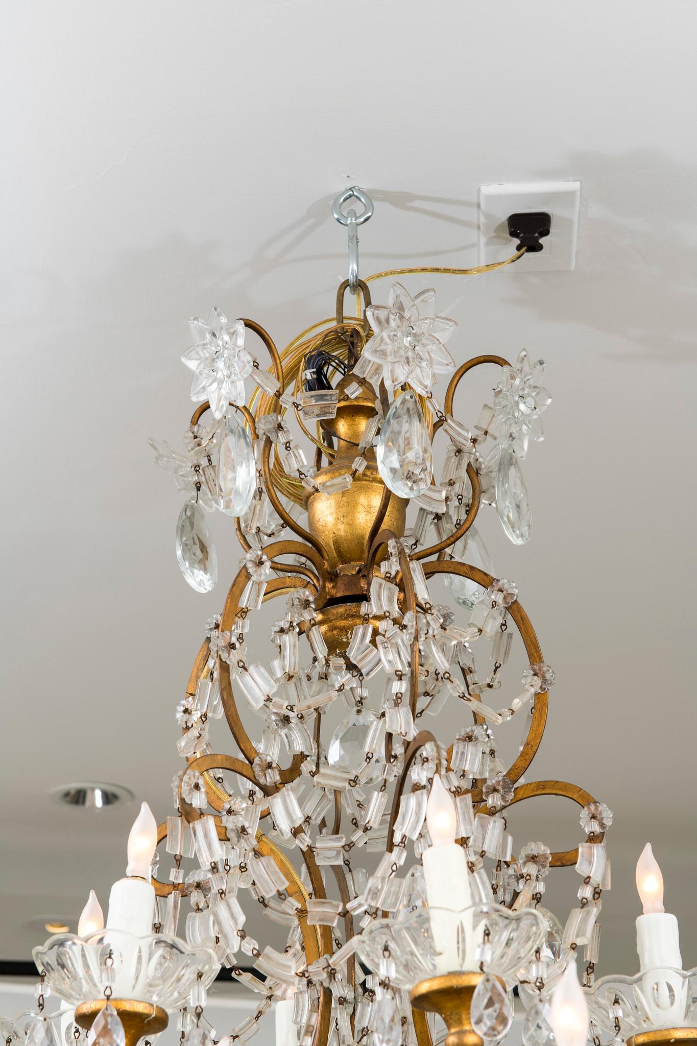 A beautifully heavily beaded 18 light Italian crystal chandelier, newly electrified.

Two available.