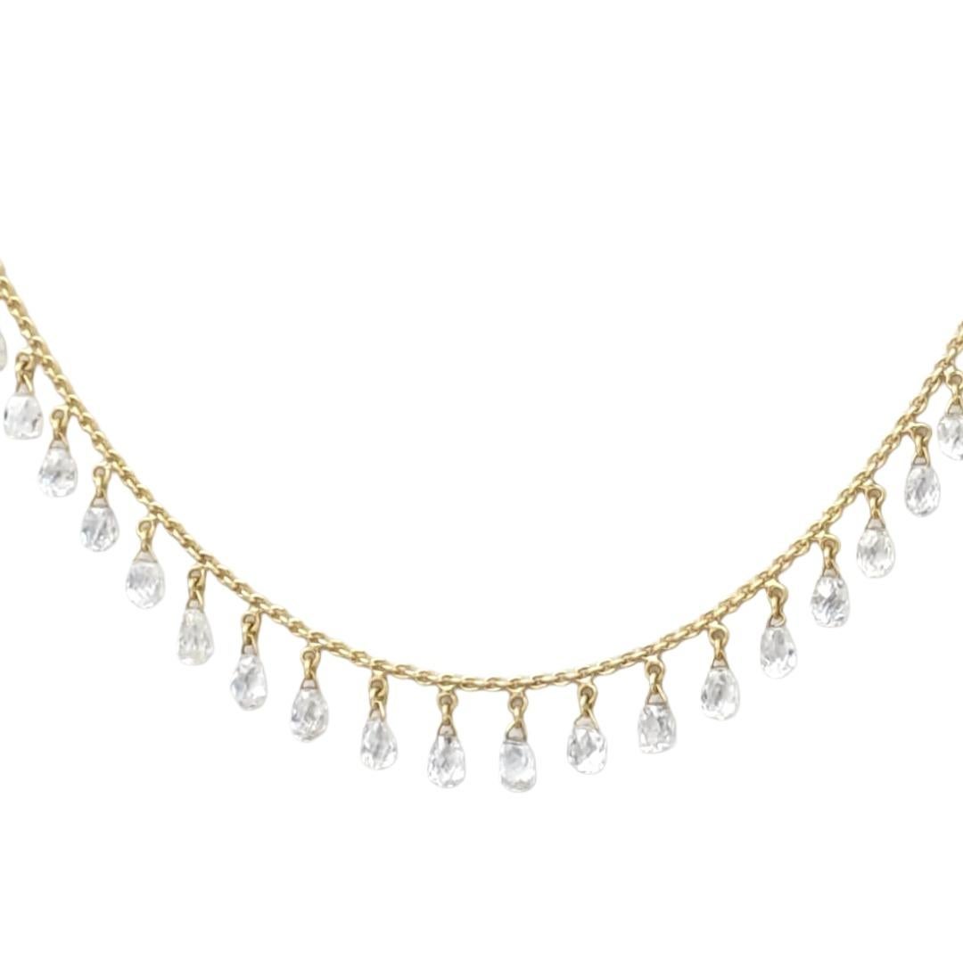 Cet élégant collier de 18 pouces présente une délicate chaîne câblée en or jaune 18 carats rehaussée de perles de diamants blancs facettés, chacune ajoutant une touche d'éclat raffiné. Les diamants sont régulièrement espacés et enveloppés à la main
