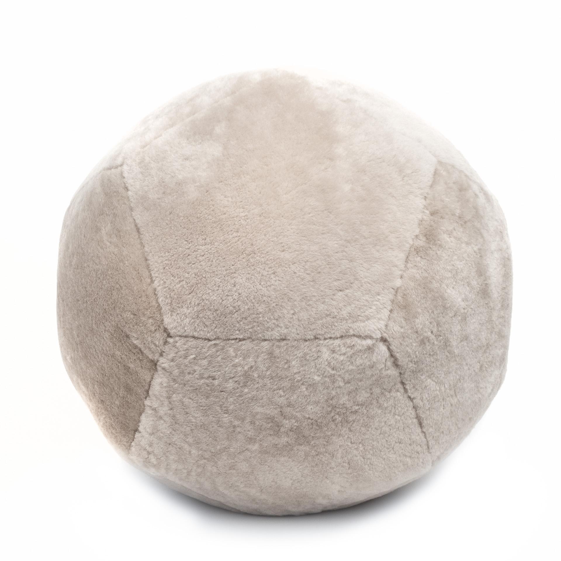 Featured in shearling, the Ottoman X is inspired by fundamental geometry. These structured and supportive round ball ottomans are designed to function as a traditional leg rest, add a twist to secondary living room seating, or as playful and