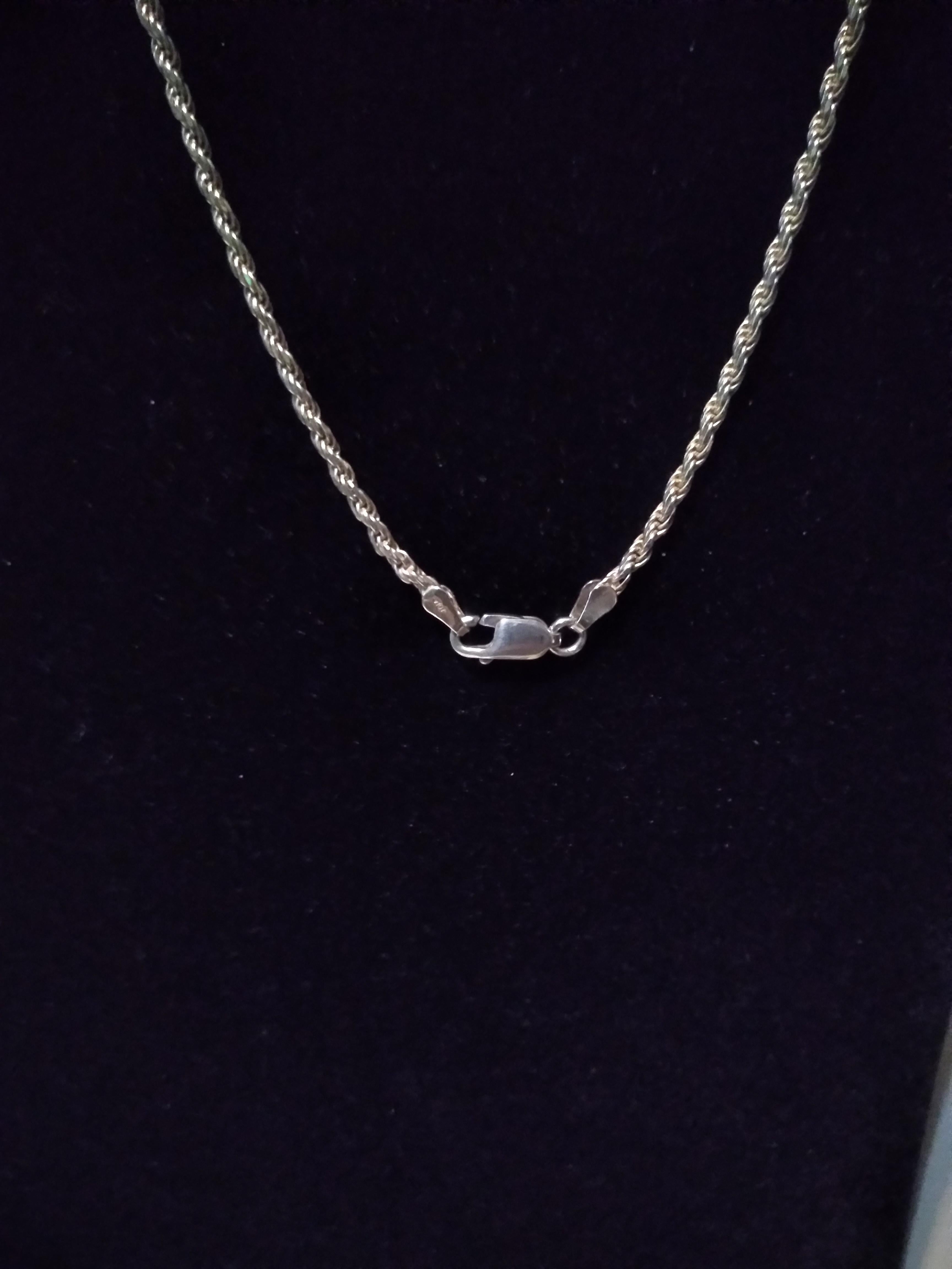 This is a beautiful Sterling Silver Rope Chain Necklace. It's approx. 2mm in diameter and has a lobster claw clamp. 