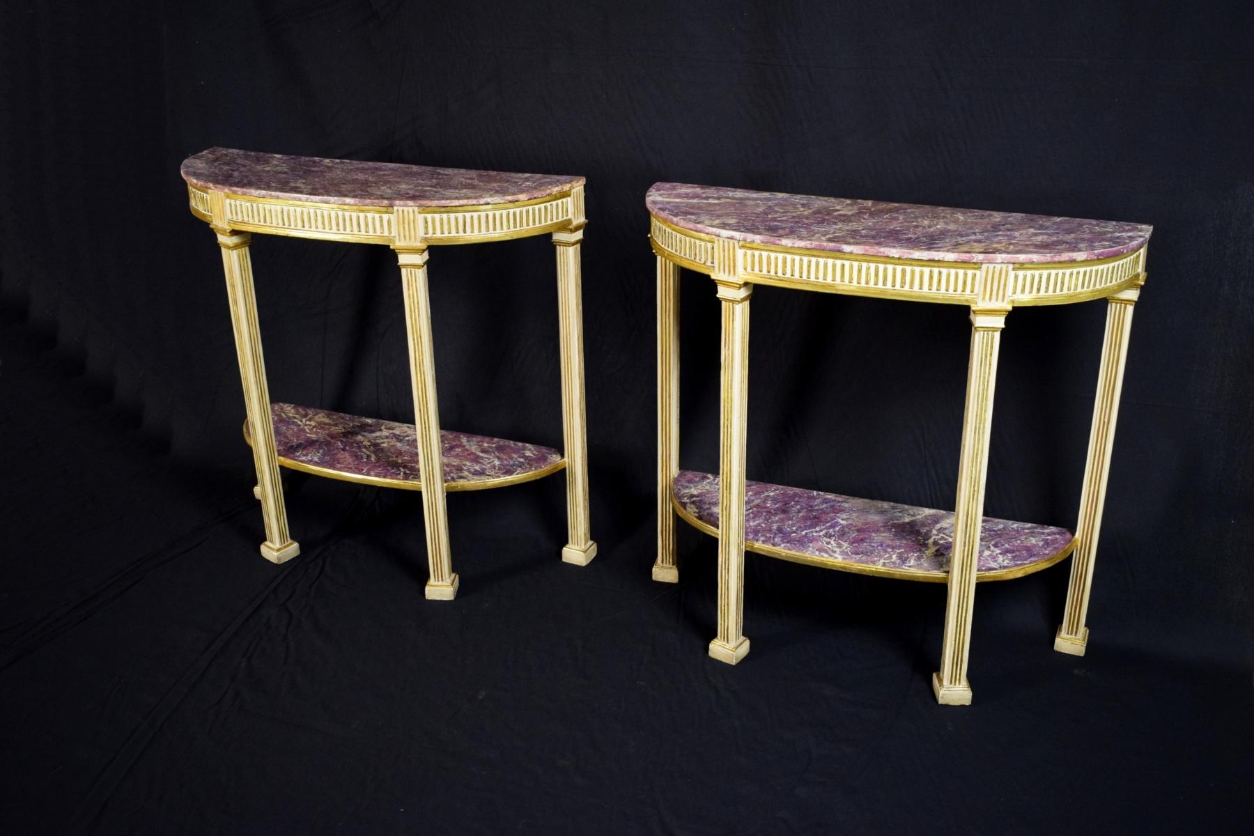 Pair of half-moon Italian consoles in lacquered and gilded wood, finely carved, false amethyst lacquered wooden shelves.
