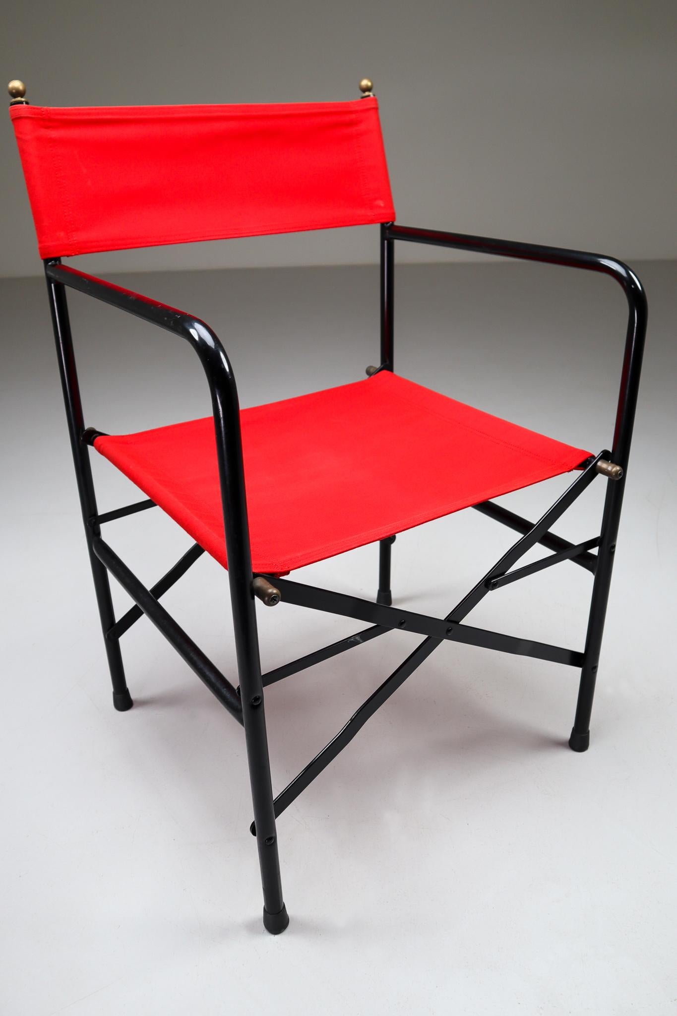 Set from 18 Venetian folding-patio-garden chairs designed and produced in Italy during the 1980s. The chairs are made from red strong fabric for the seat and backrest. The frame is made of black lacquered steel with brass details. They are