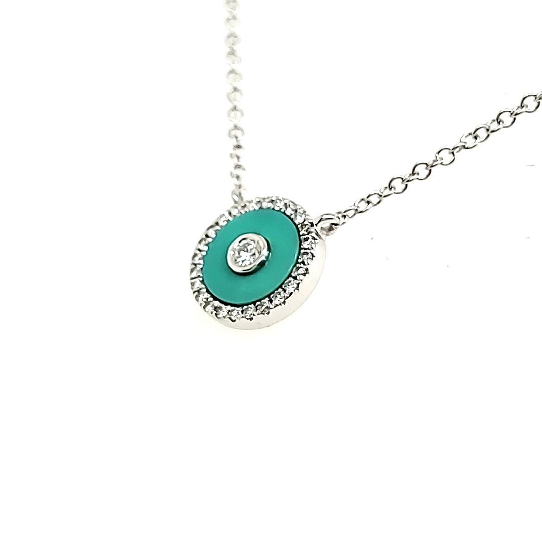 Nestled amidst a halo of 25 shimmering round diamonds totaling 0.11 carats, our captivating turquoise gemstone, weighing 0.47 carats, takes center stage.

All are encased in luxurious 18K white gold, weighing 2.18 grams, and complemented by an