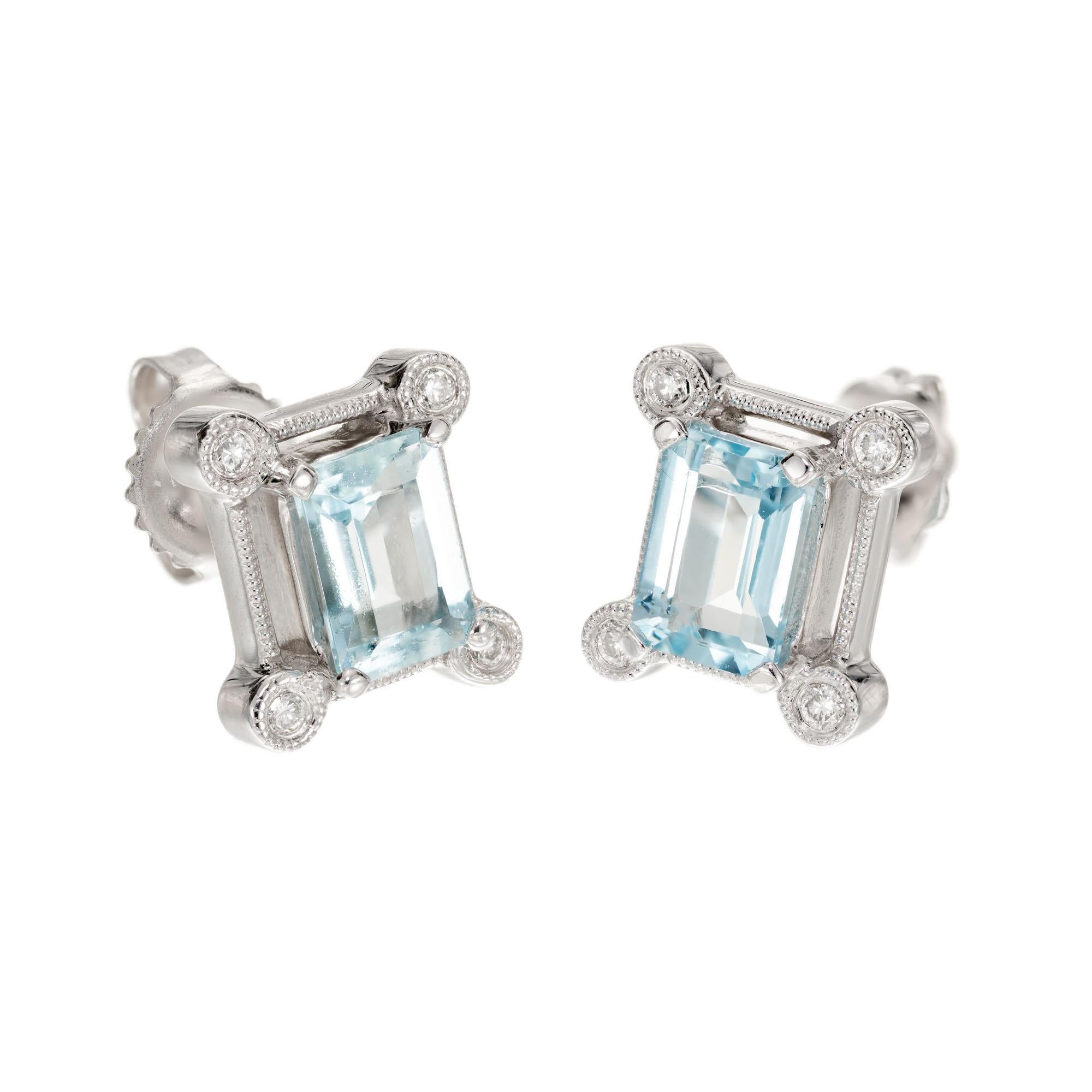 1.80 carat rectangular natural Aqua earrings with bright full cut Diamond accents in 14k white gold settings. 

2 Emerald cut blue Aquamarines, approx. total weight 1.80cts, 7.2 x 5.1mm
8 round full cut Diamonds, approx. total weight .08cts, H,